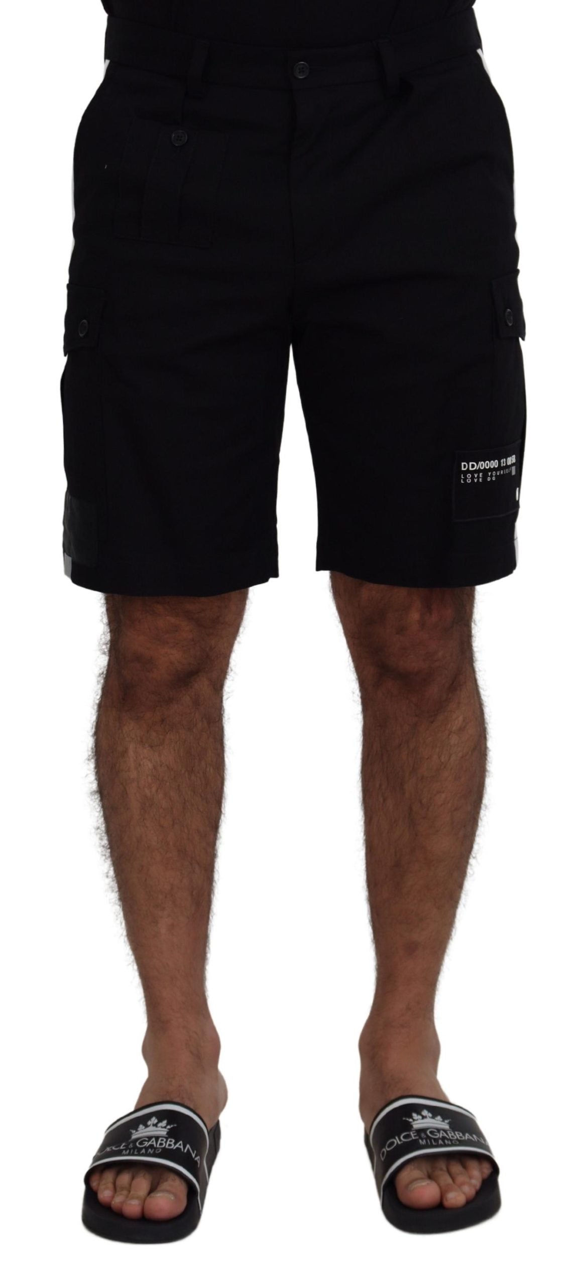Man wearing black shorts and flip flops