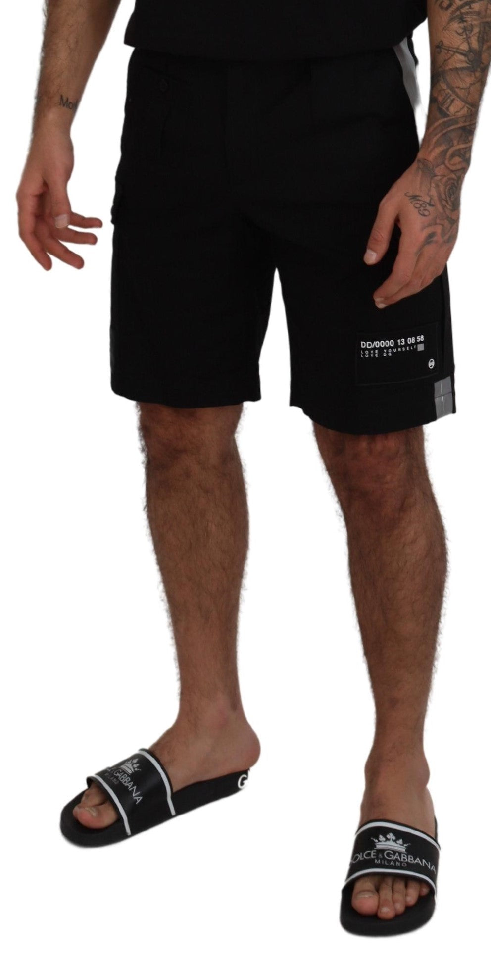 Man wearing black shorts and sandals