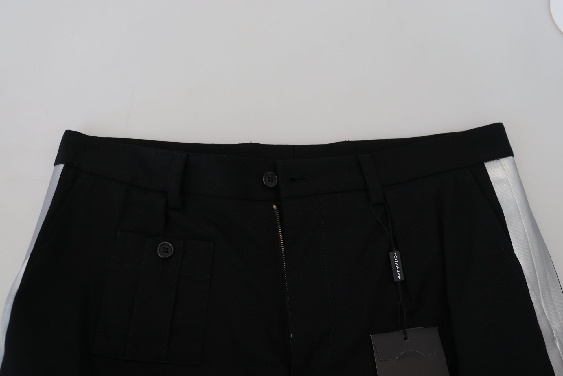 Pair of black cargo shorts with pockets and zippers