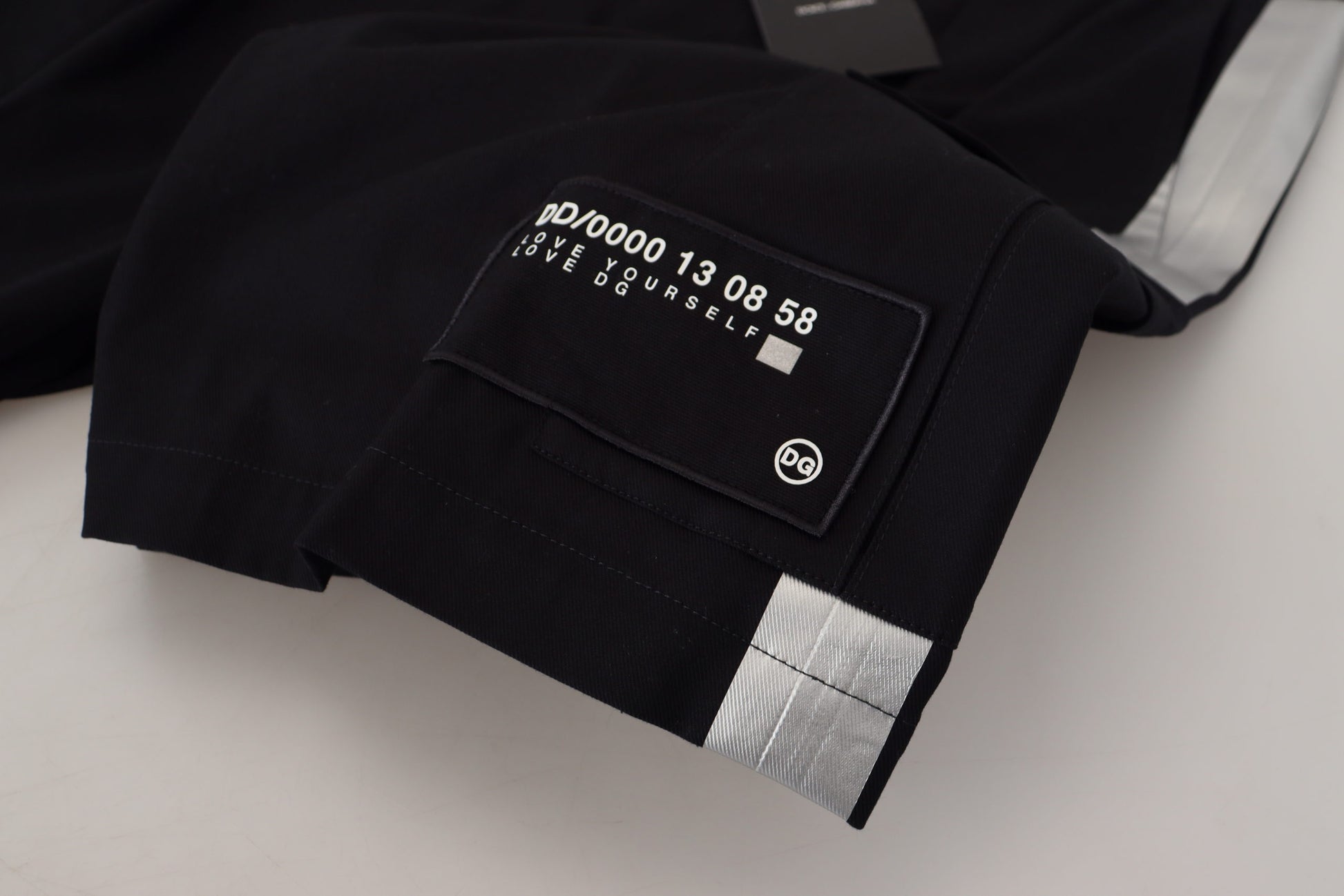 Black jacket with white label on sleeve