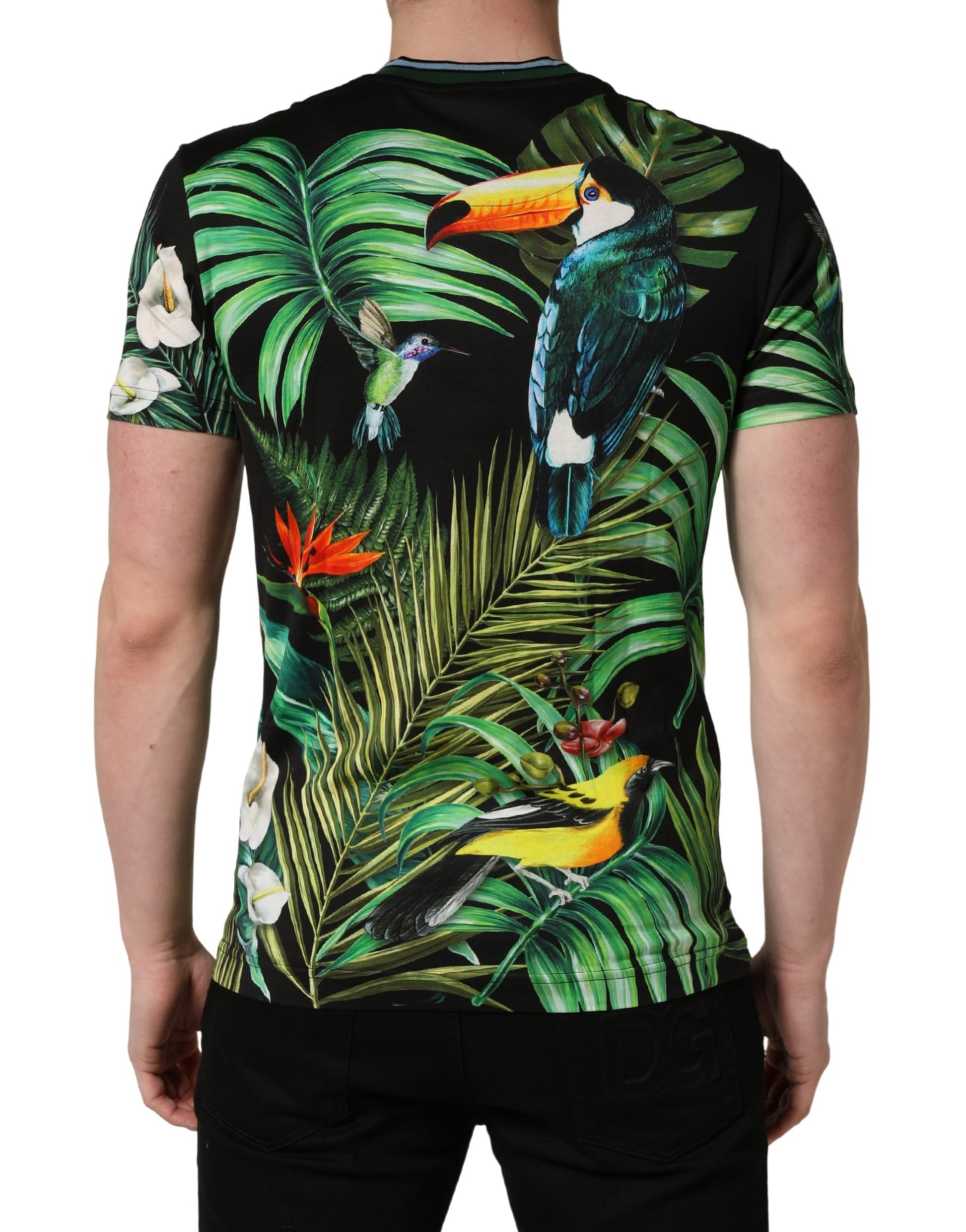 Back view of a short sleeve shirt with tropical print featuring parrots and palm leaves