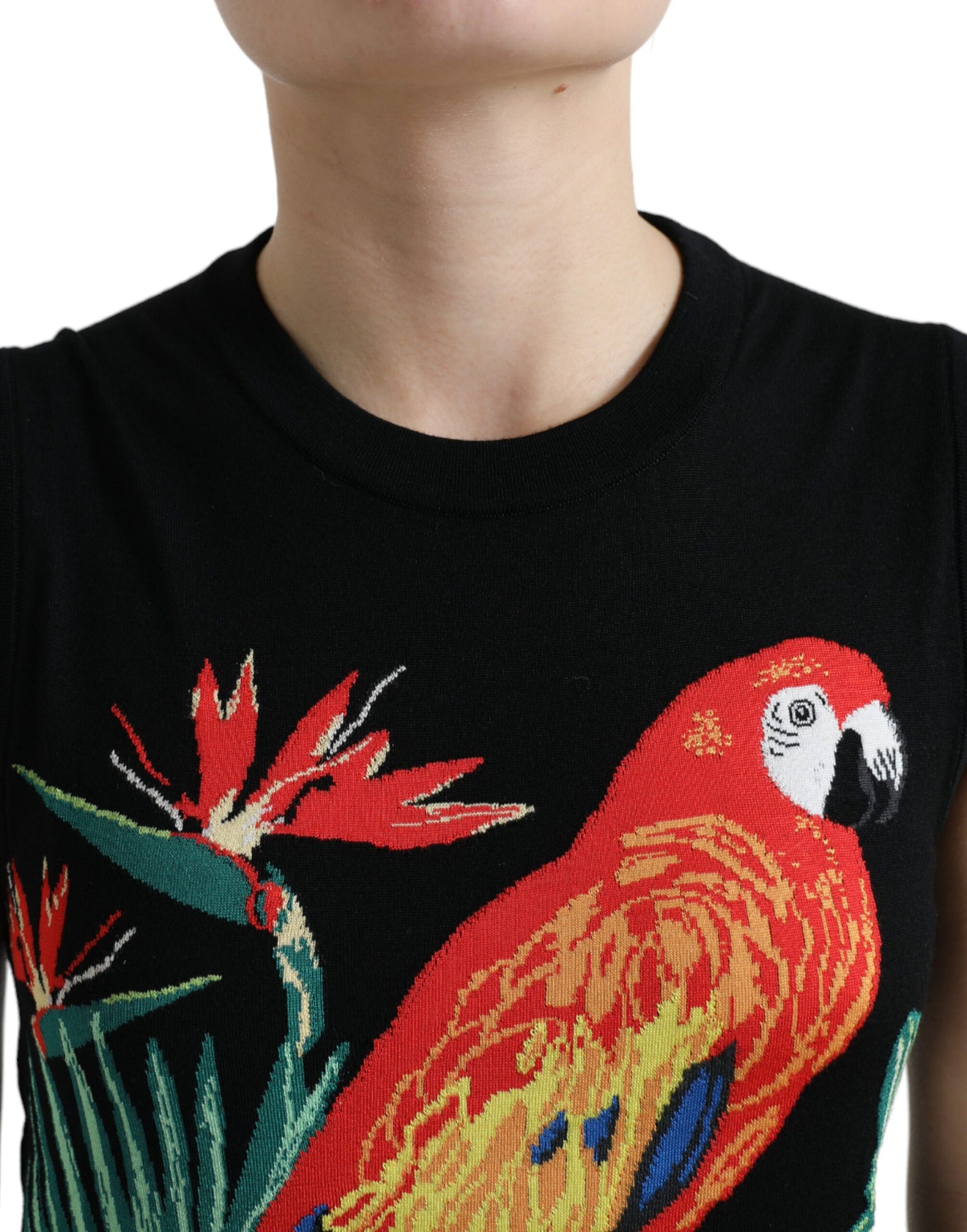Woman wearing black shirt with parrot design
