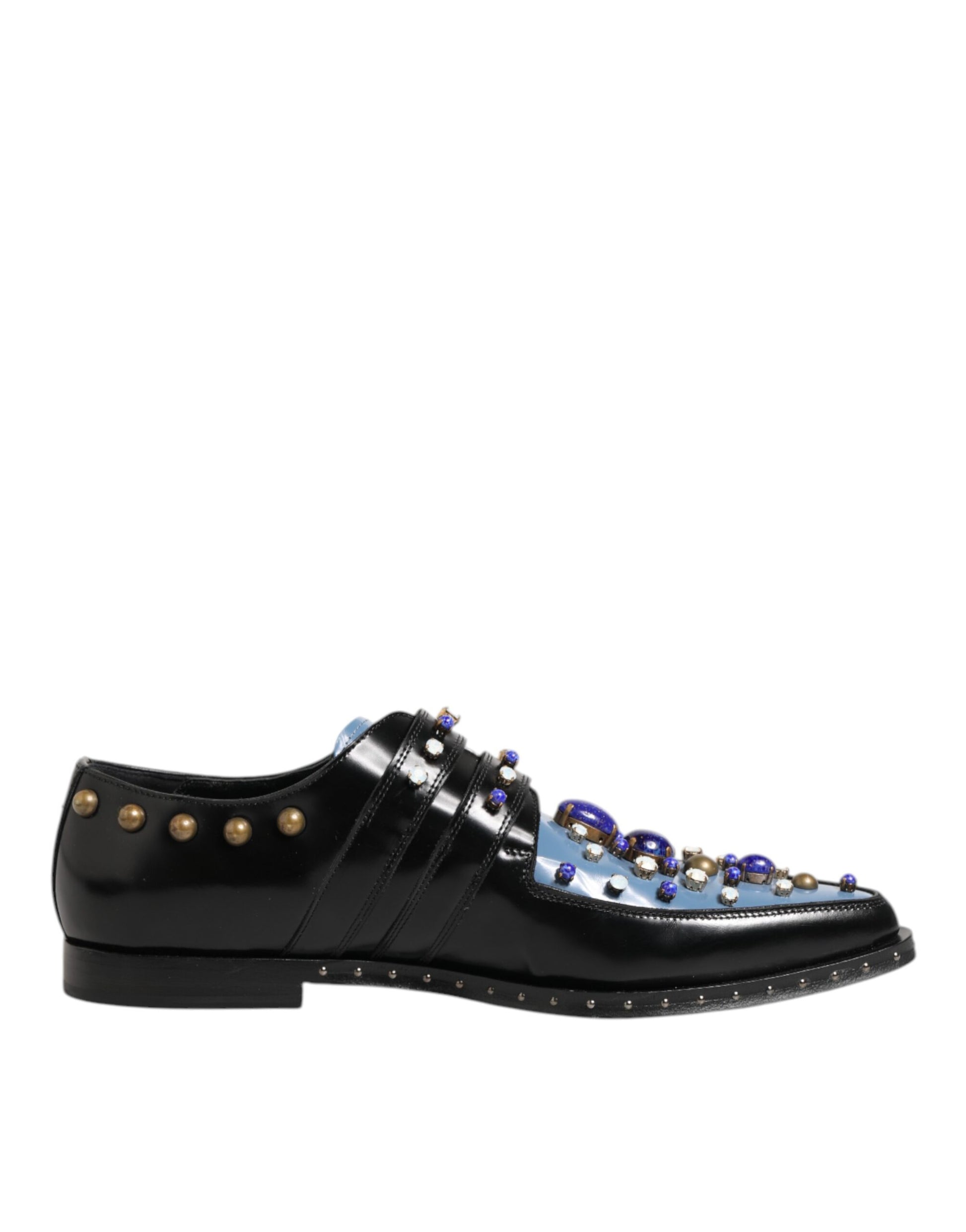 A pair of black dress shoes with blue embellishments and gold studs