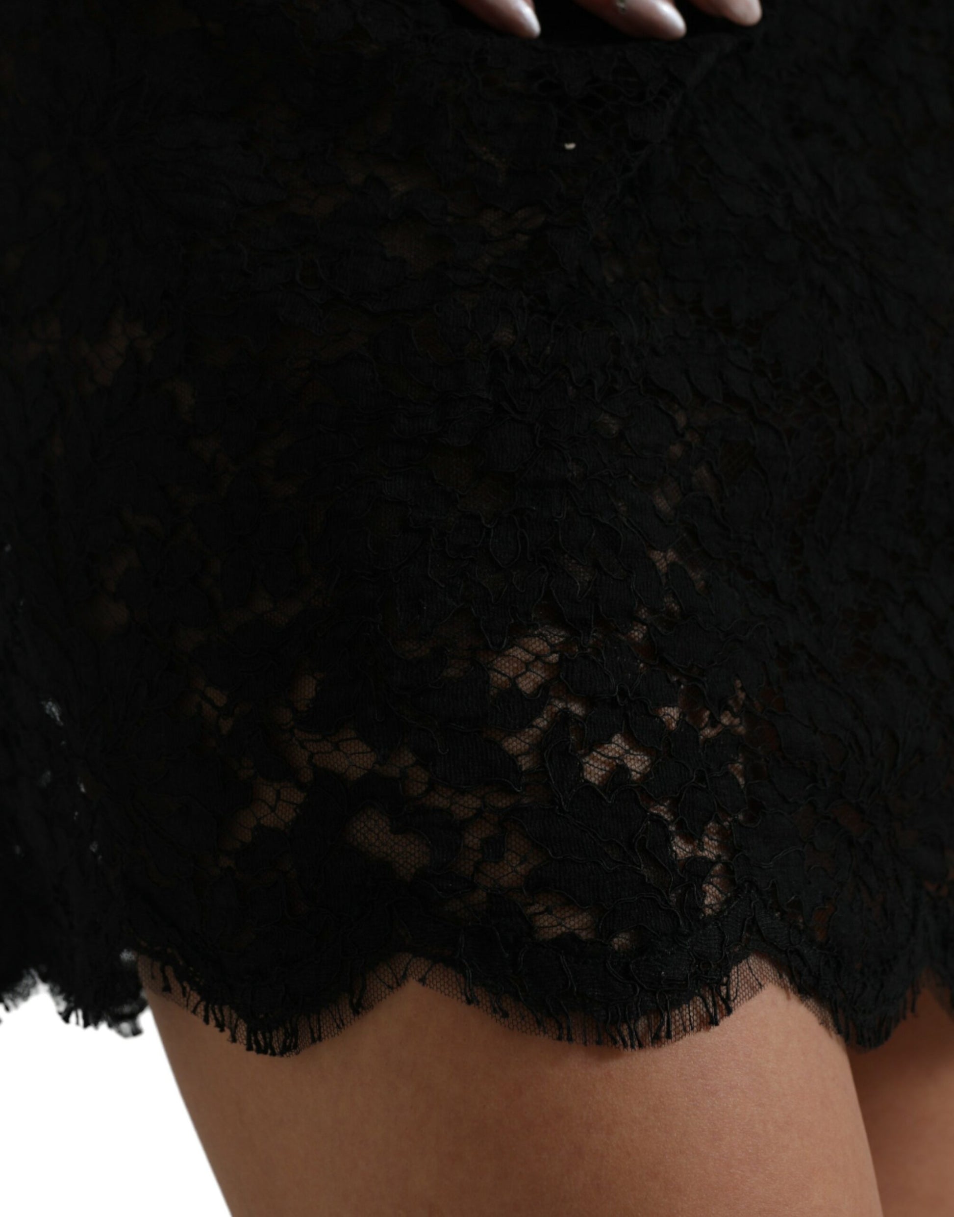 A black lace bodycon dress with short sleeves and a sheath style