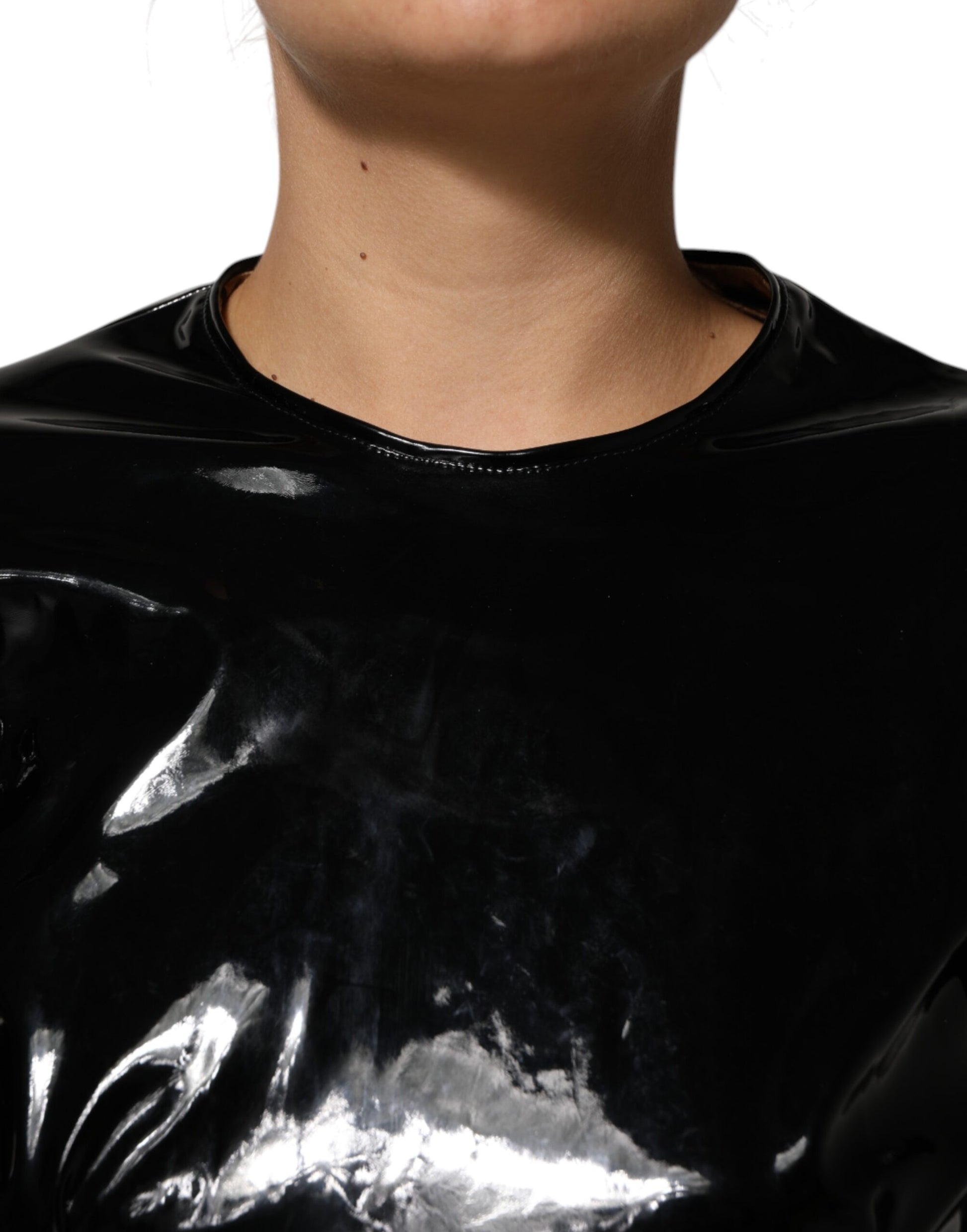 A black bodycon sheath dress with puff sleeves and a mini length