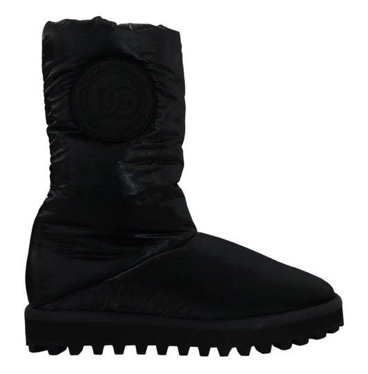 Black suede boot with logo on side and rubber sole