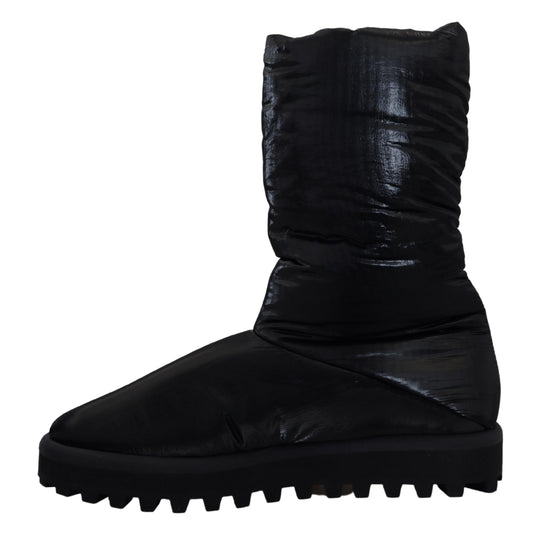 Black rubber boot with thick sole and lace up front