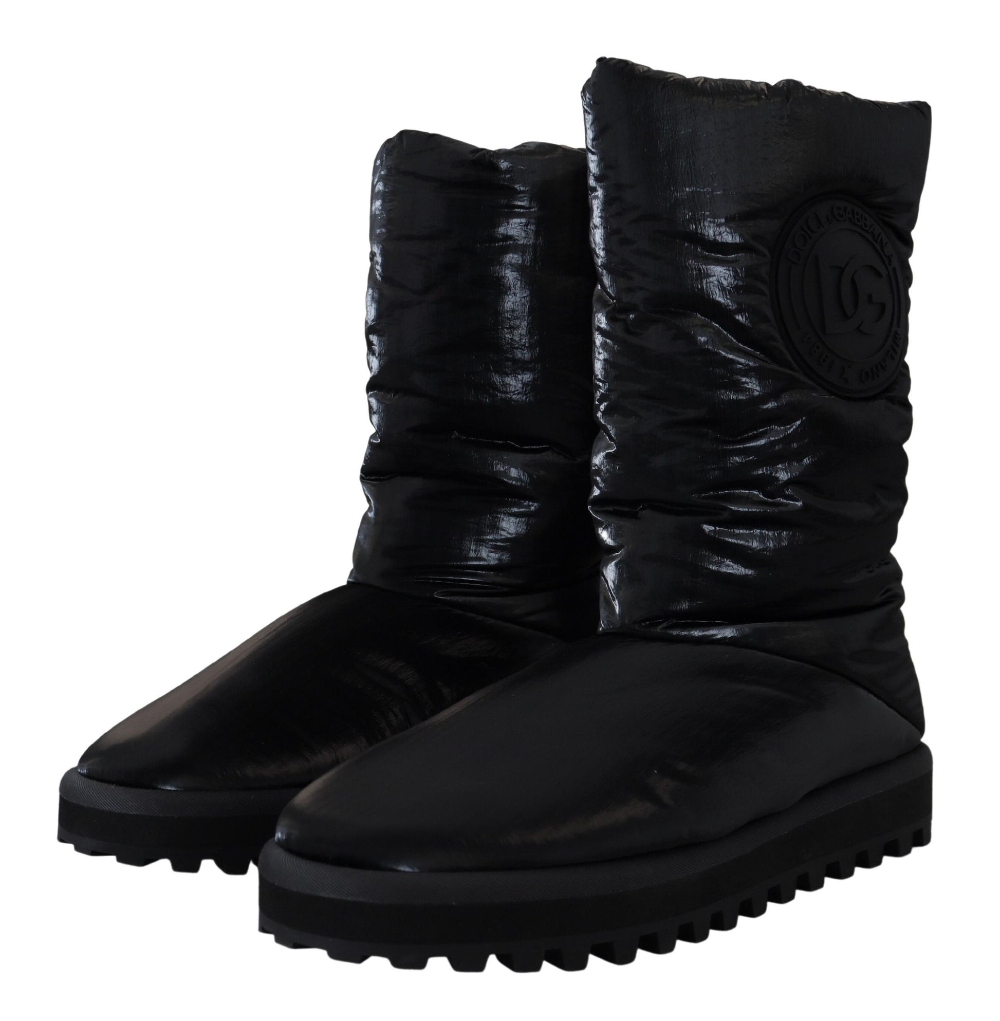 Pair of black boots with a logo on the side