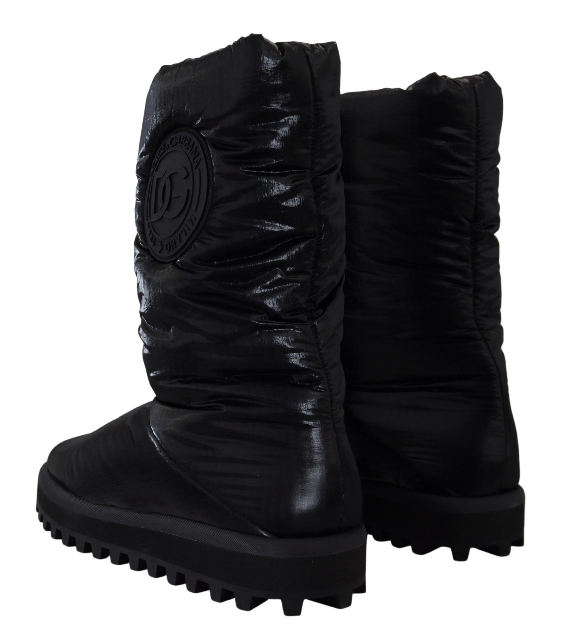 Pair of black rubber boots with a logo on the side