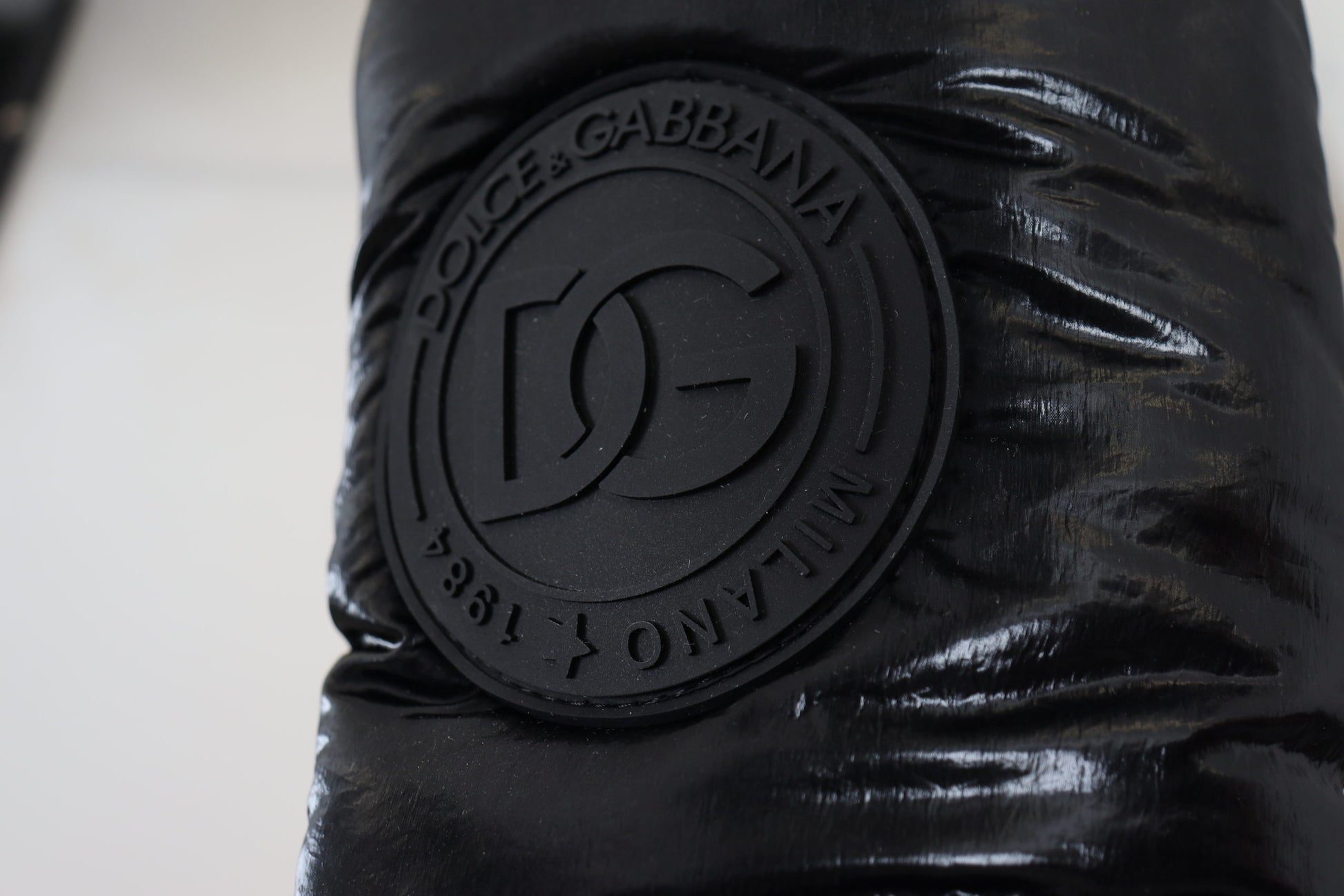 Black fabric with logo embossed on it