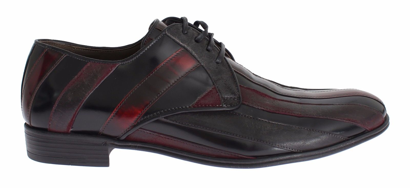 Pair of black leather dress shoes with red accents, laces and soles