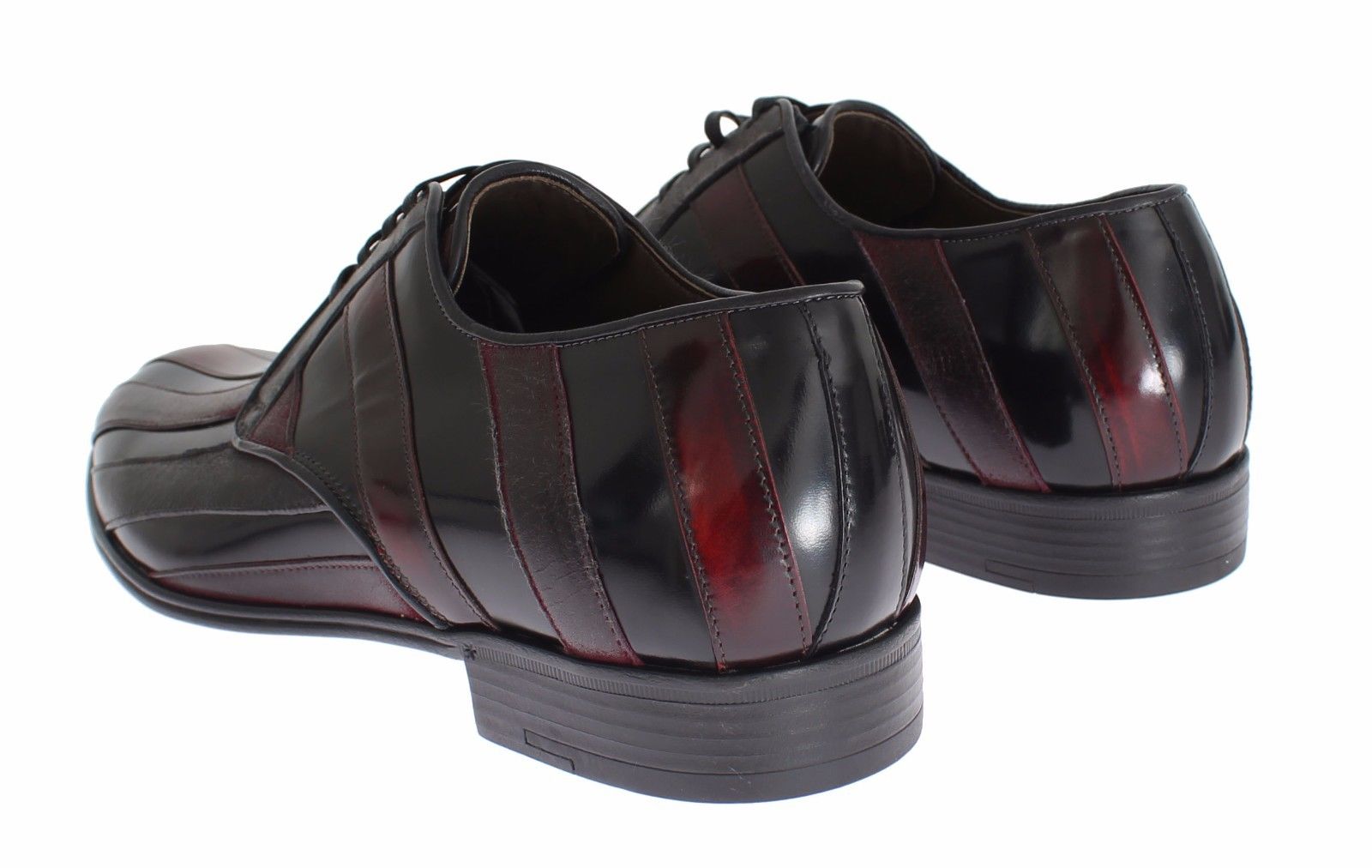 Pair of black leather dress shoes with red accents and a shiny finish