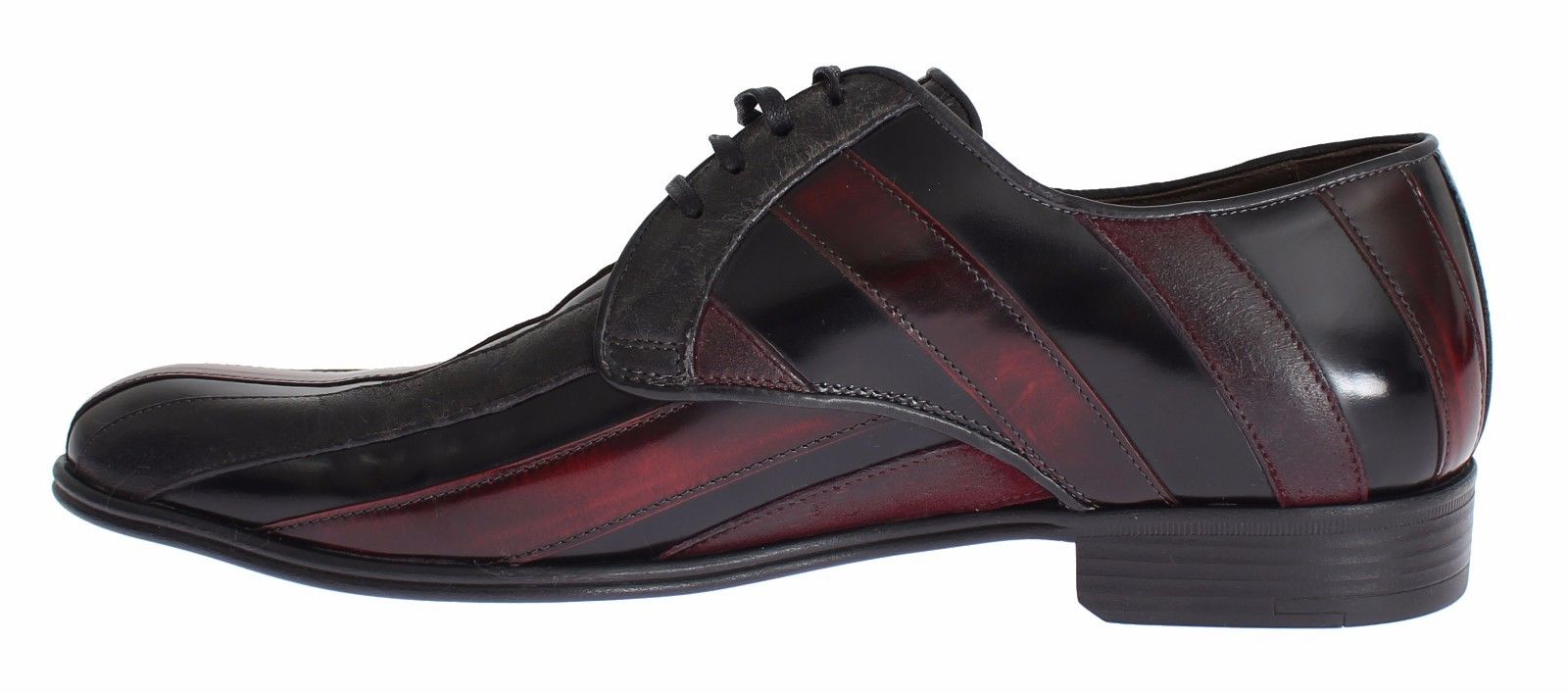 A pair of black dress shoes with red accents, featuring a lace-up design and a low heel