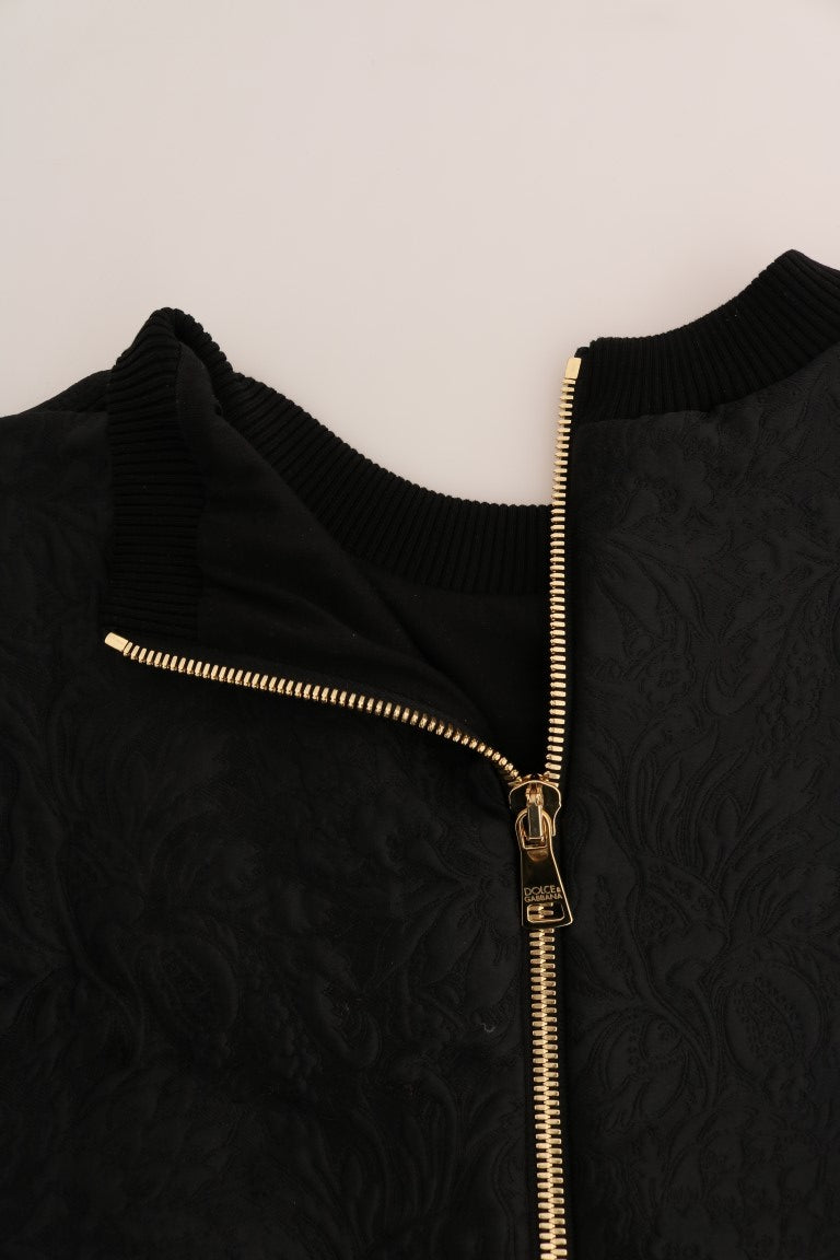 Black zippered jacket with gold accents