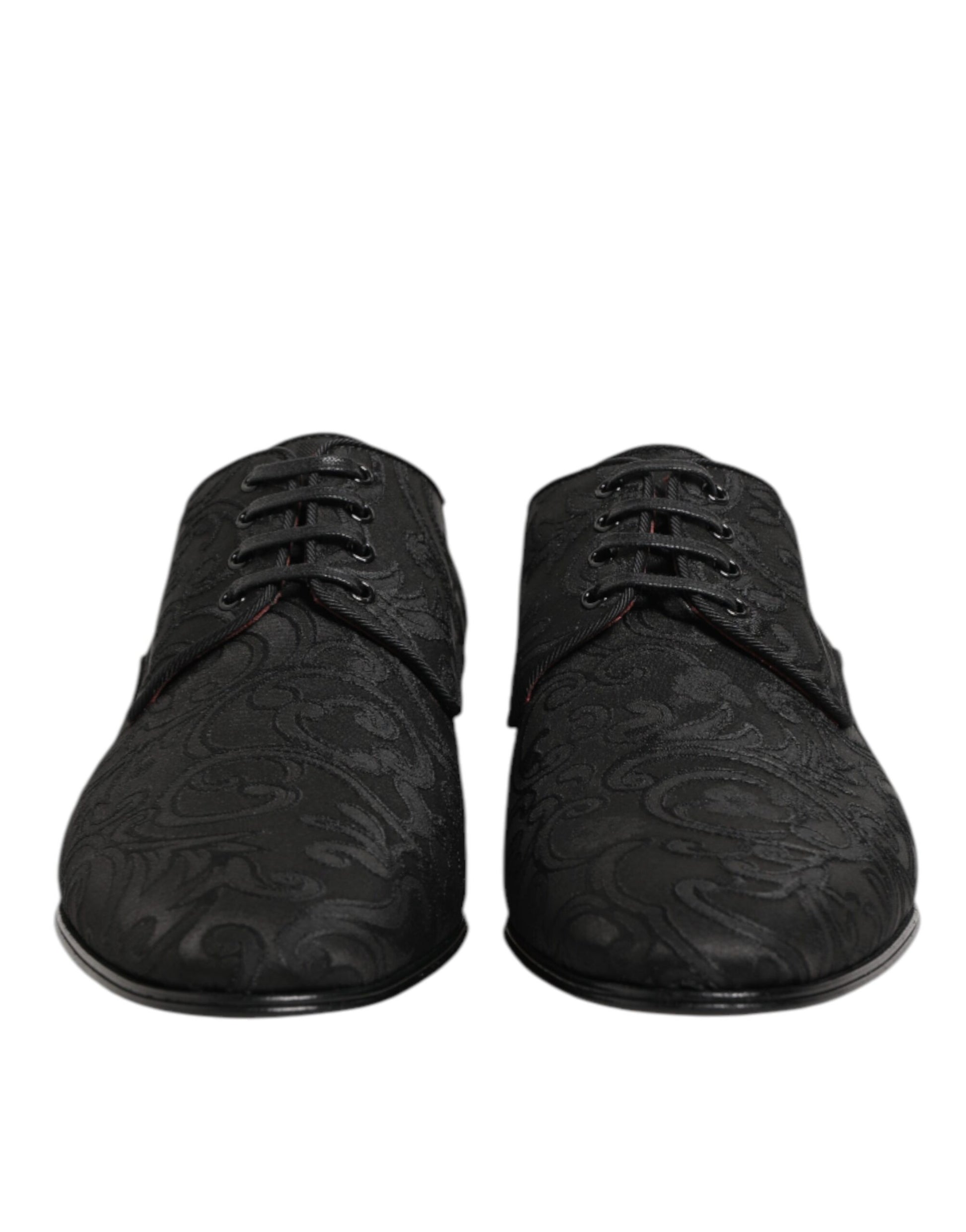 Pair of black brocade lace-up dress shoes with red accents, designed by Dolce & Gabbana