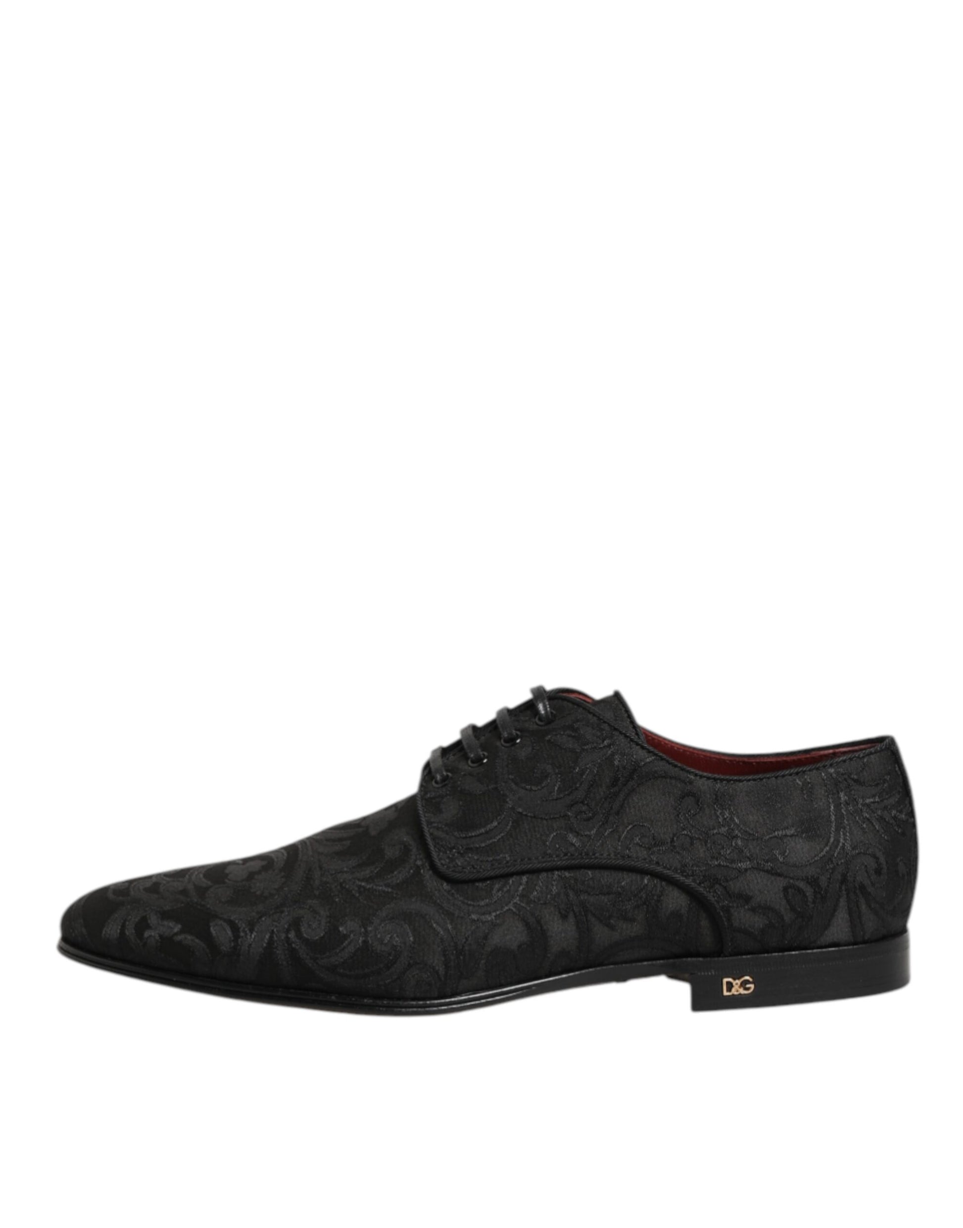 A pair of black brocade lace up derby shoes by Dolce & Gabbana