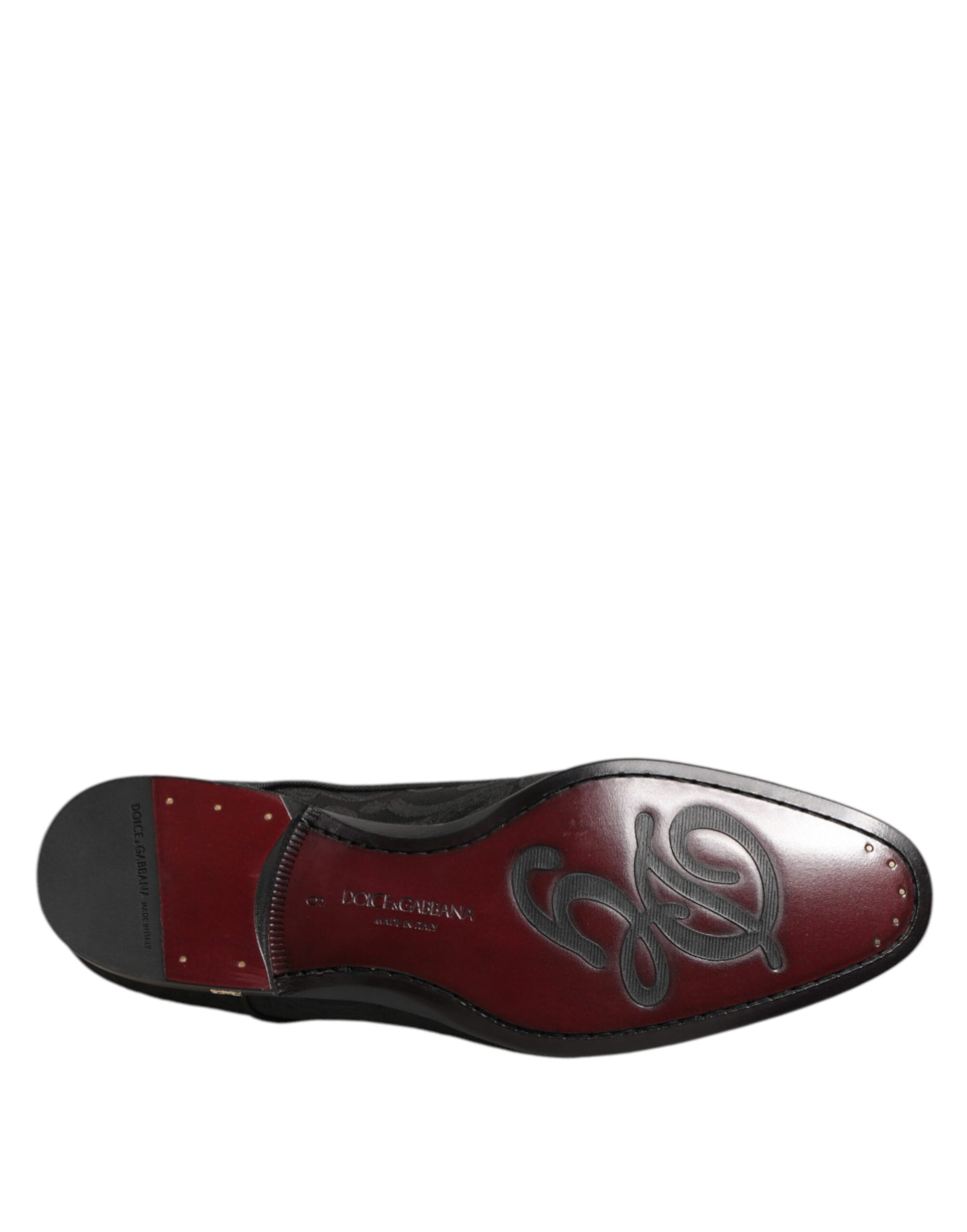 Red and black lace-up dress shoes with brocade design, branded by Dolce & Gabbana