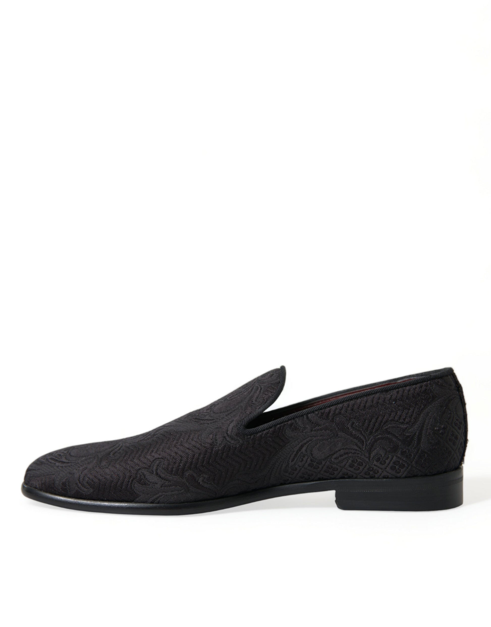 Pair of black loafers with a patterned design on the side