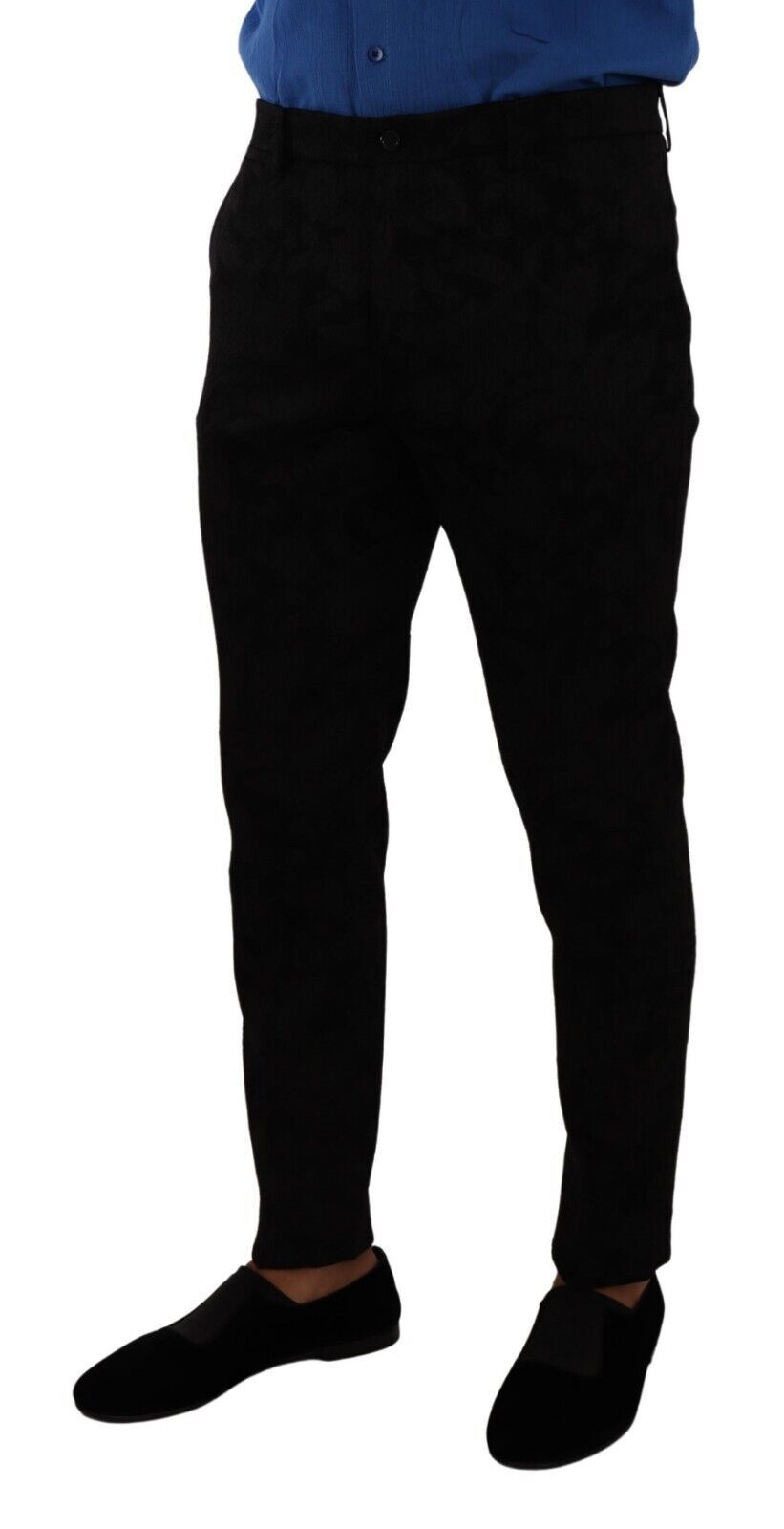 Man wearing black pants and blue shirt