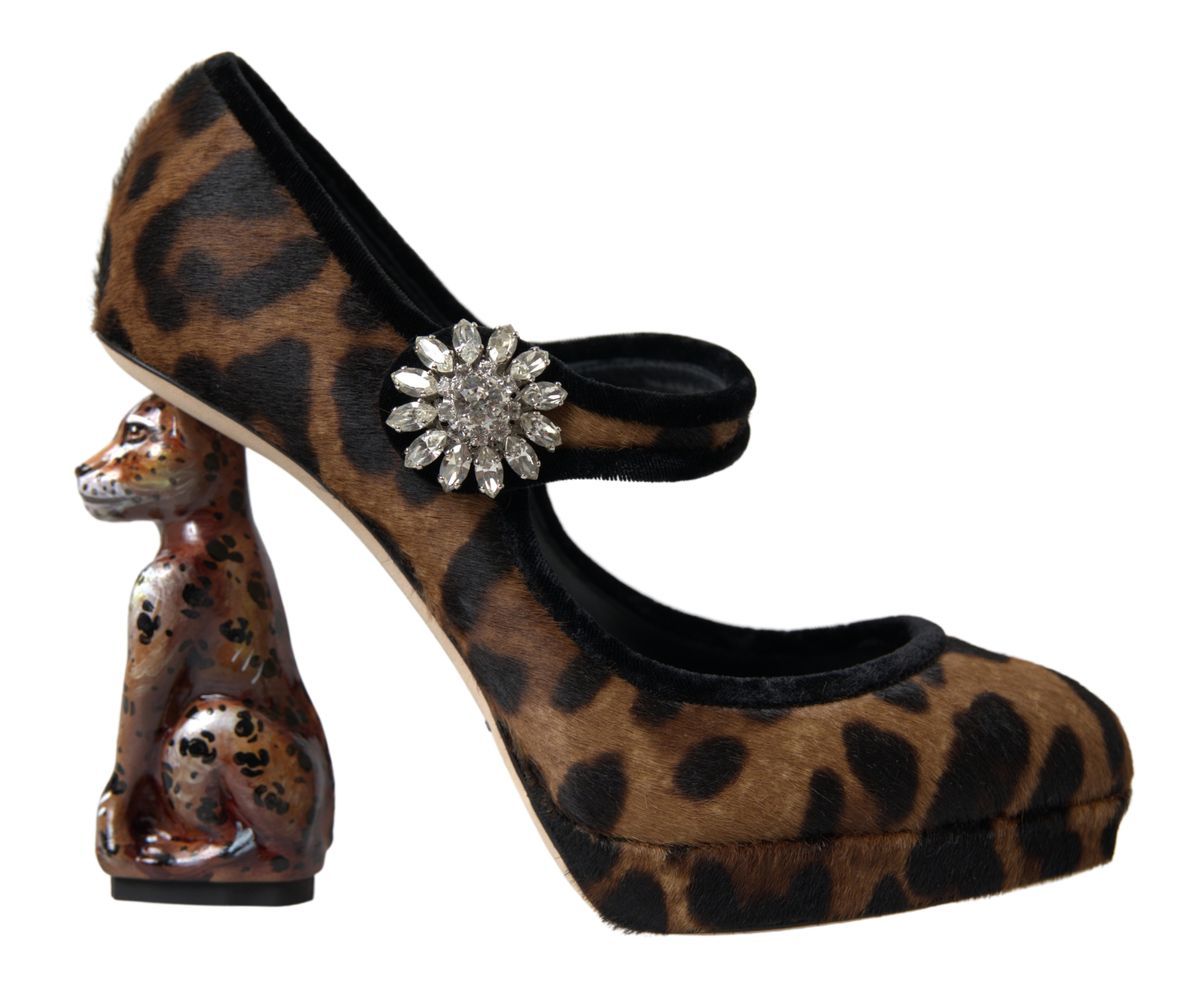 Leopard print high heel shoes with rhinestone buckle and a small figurine of a dog on the heel