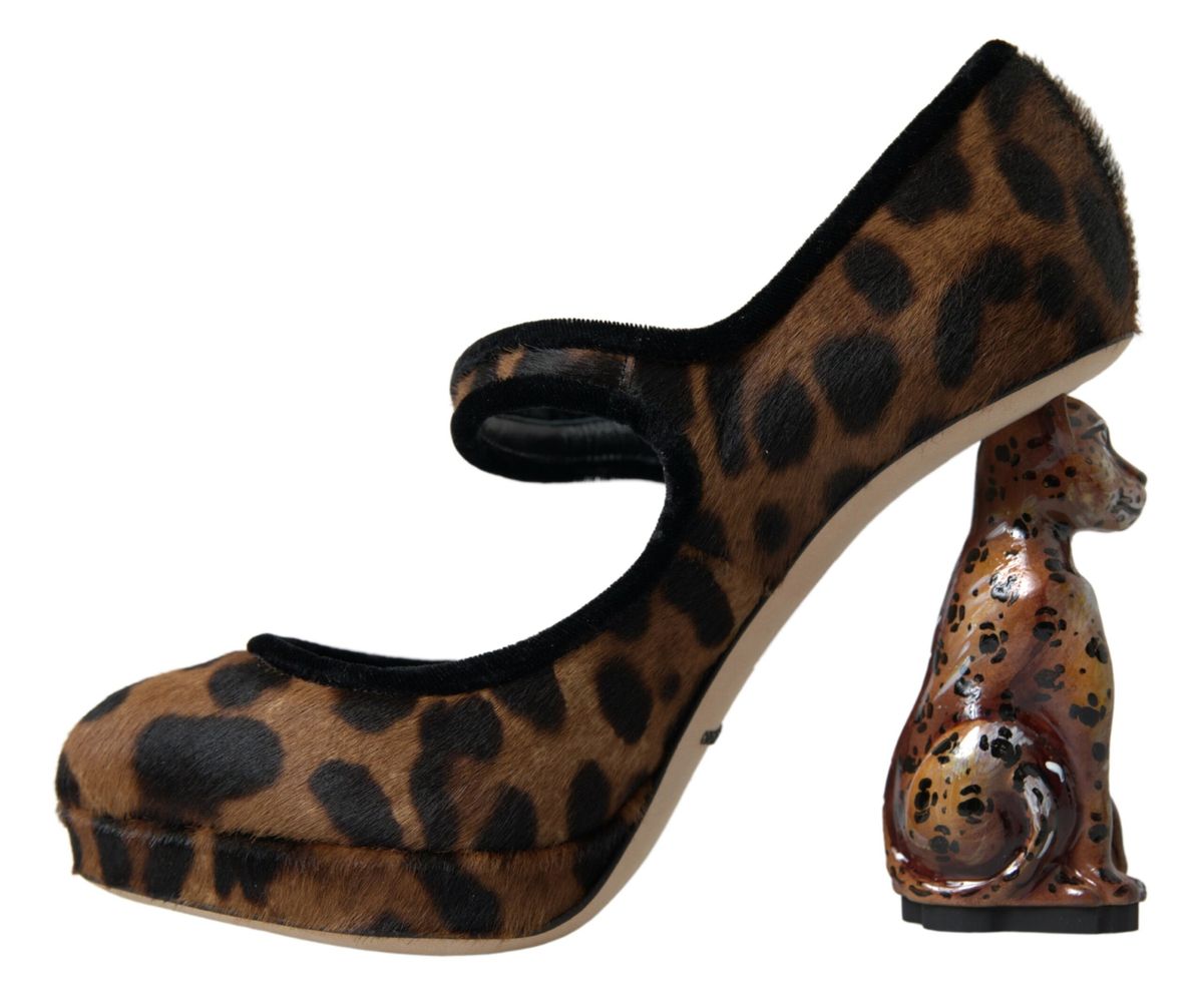 Leopard print high heel shoe with a small figurine of a dog on the heel