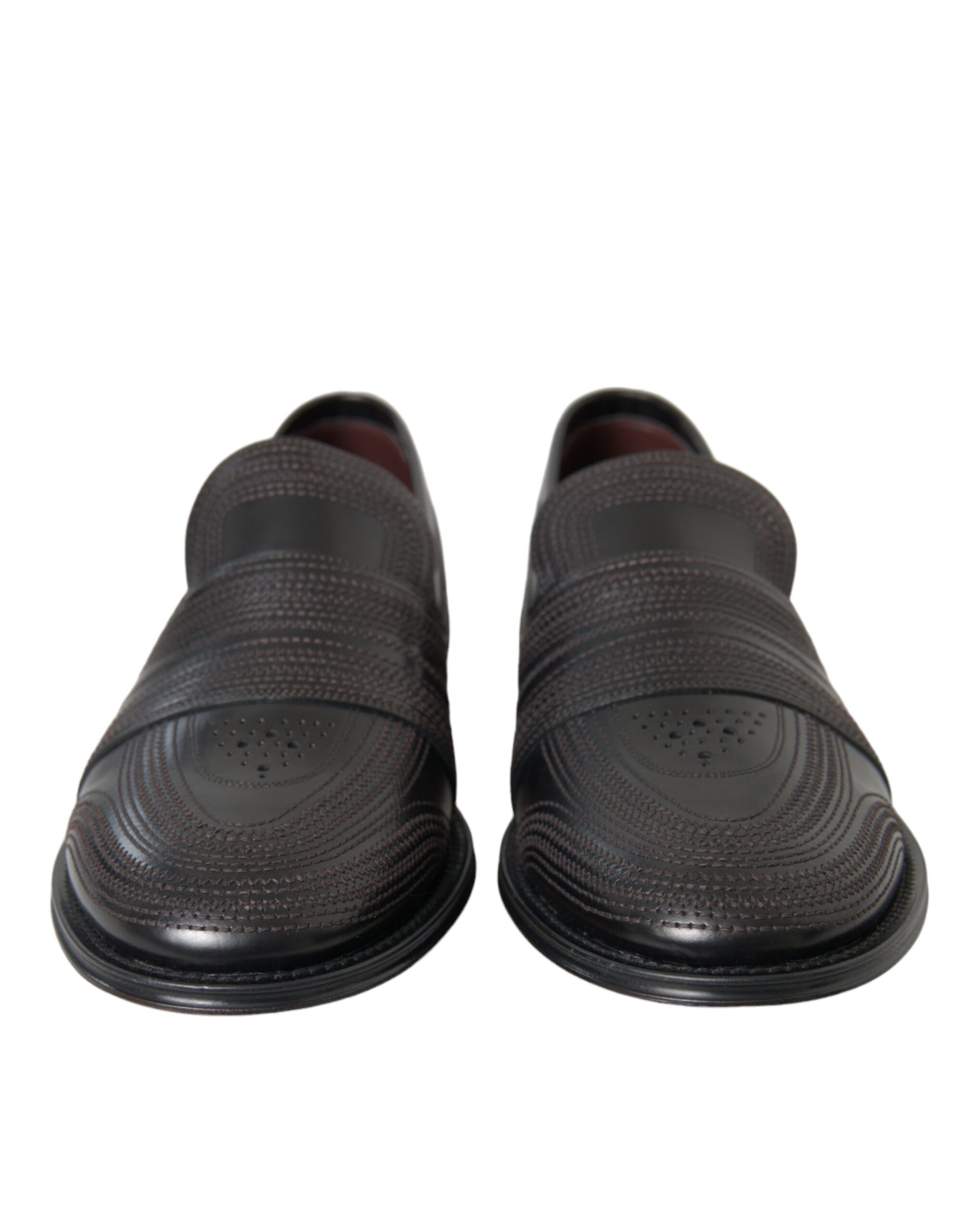 Pair of black shoes with a patterned design on top
