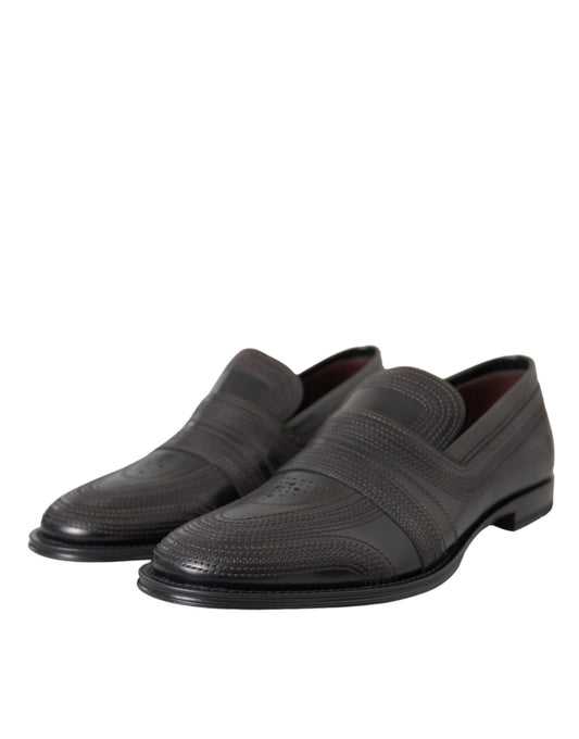 Pair of black leather dress shoes with laces