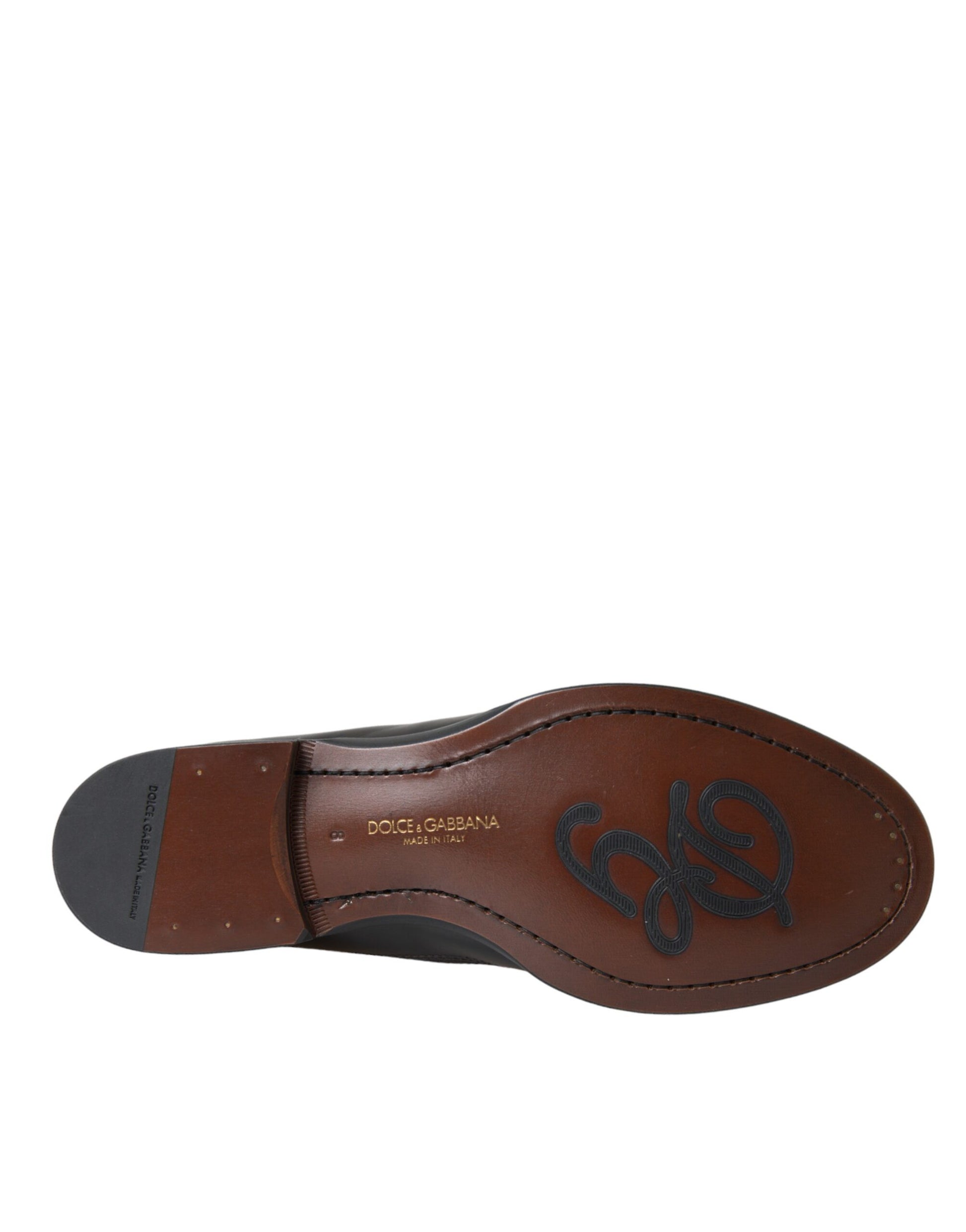 Brown leather shoe with strap over foot
