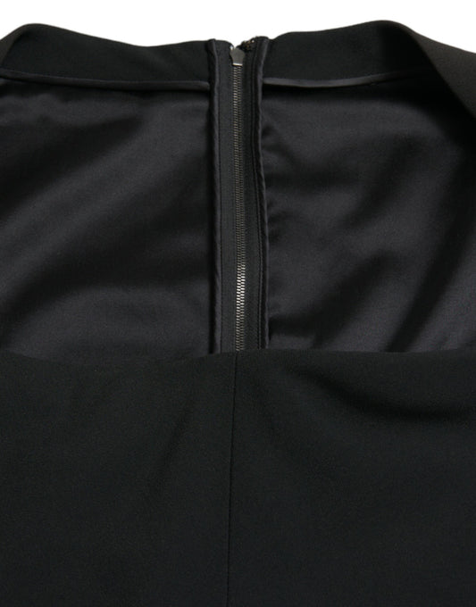 A black sleeveless dress with a zippered front and viscose material