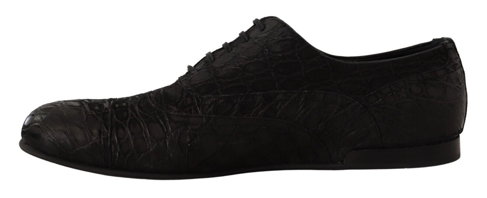 Pair of black shoes with a patterned design on the side