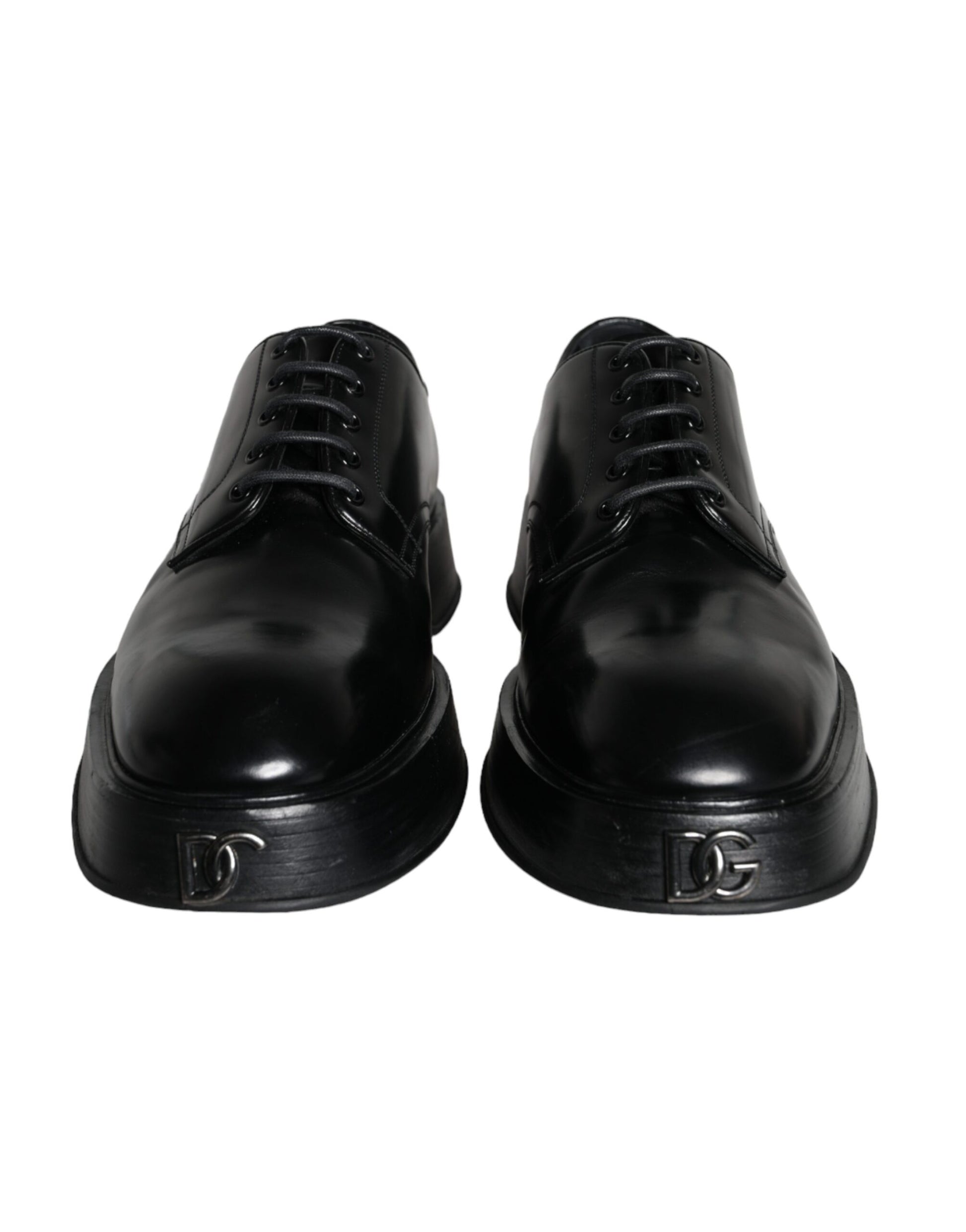 Pair of black leather dress shoes with laces and a small emblem on the side