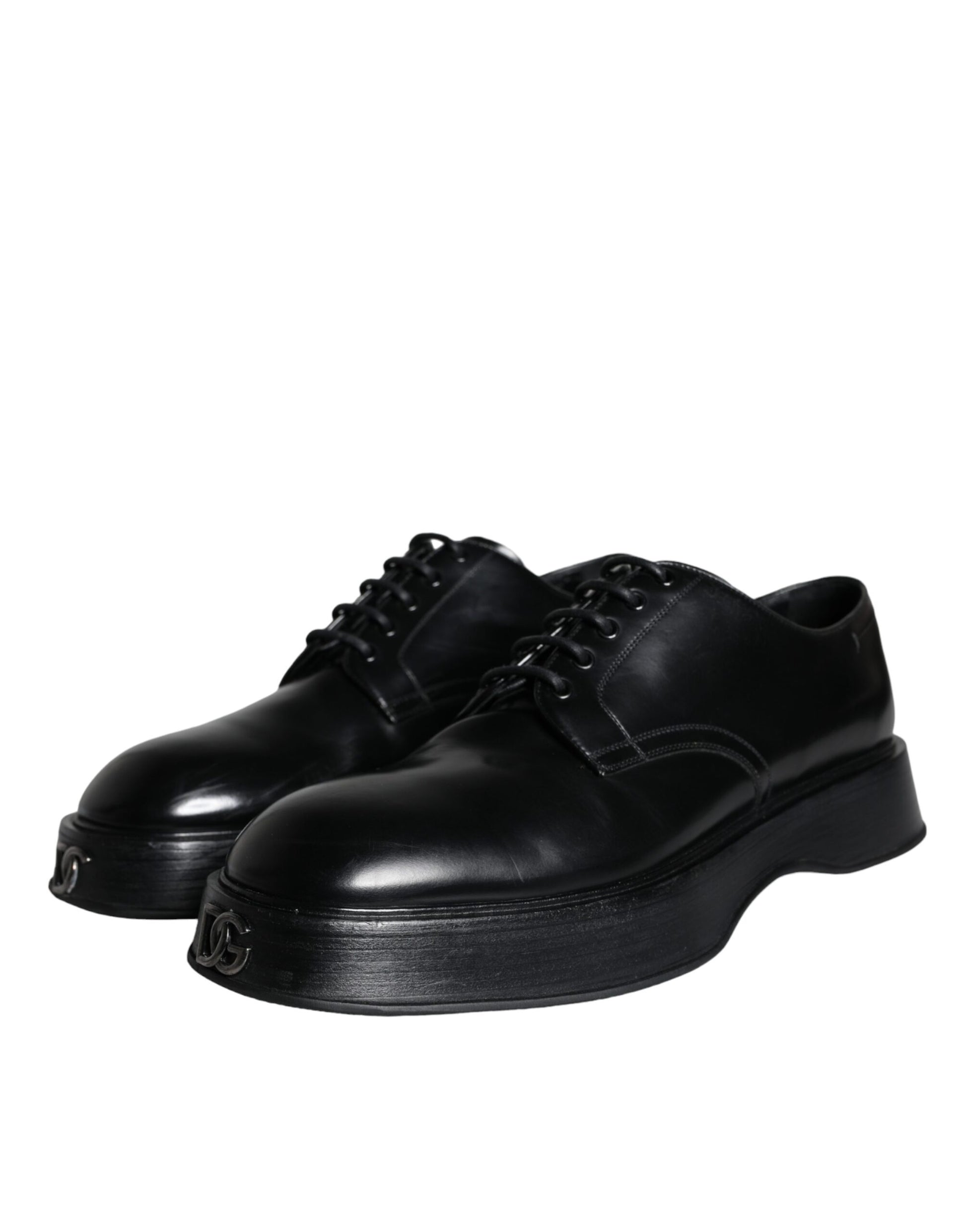 Pair of black leather dress shoes with laces and a small heel, featuring a shiny finish