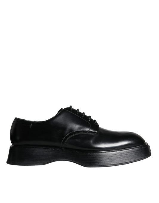 A pair of black leather dress shoes with a low heel and laces, designed by Dolce & Gabbana