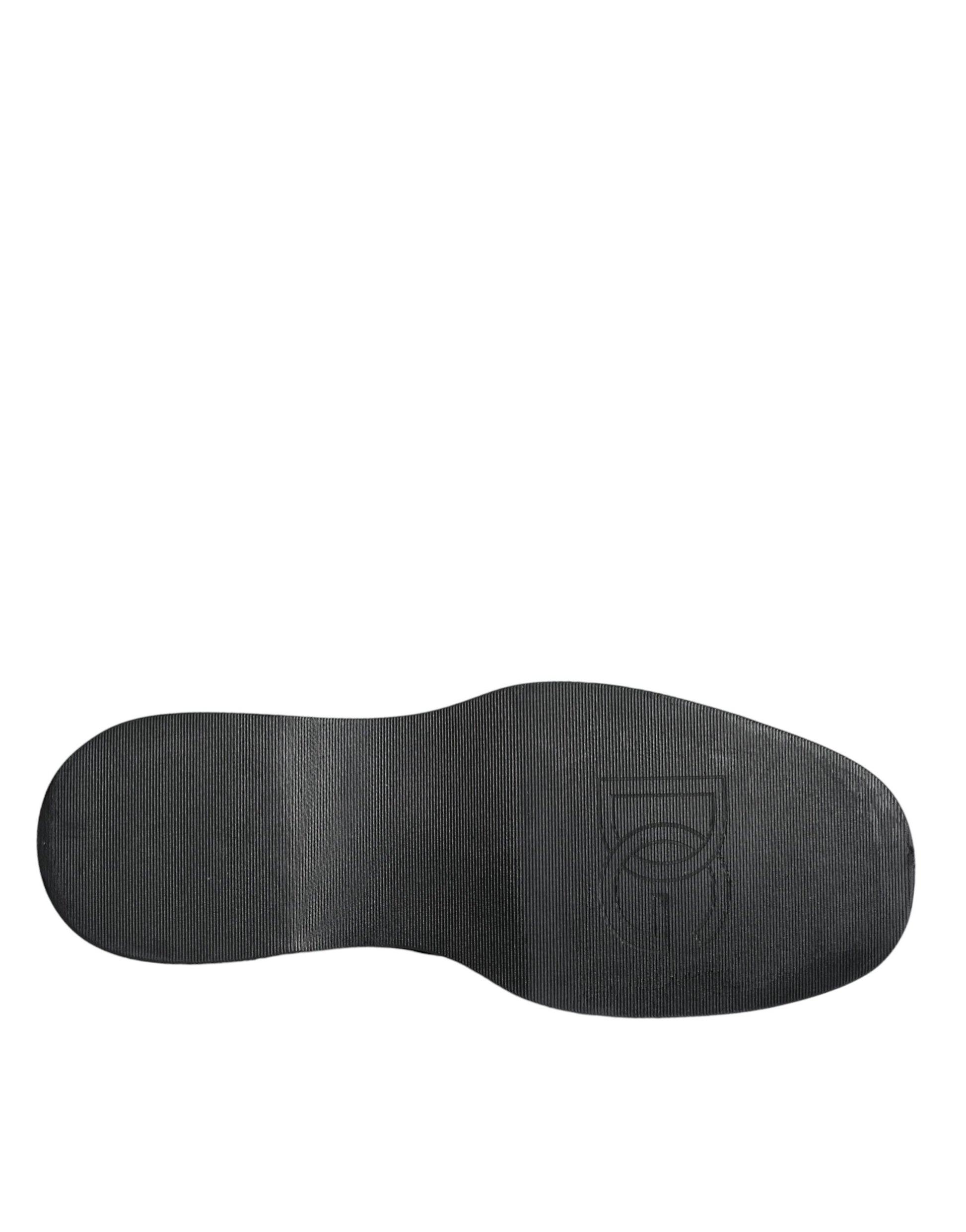 A pair of black calf leather derby shoes with a logo on the side, designed by Dolce & Gabbana