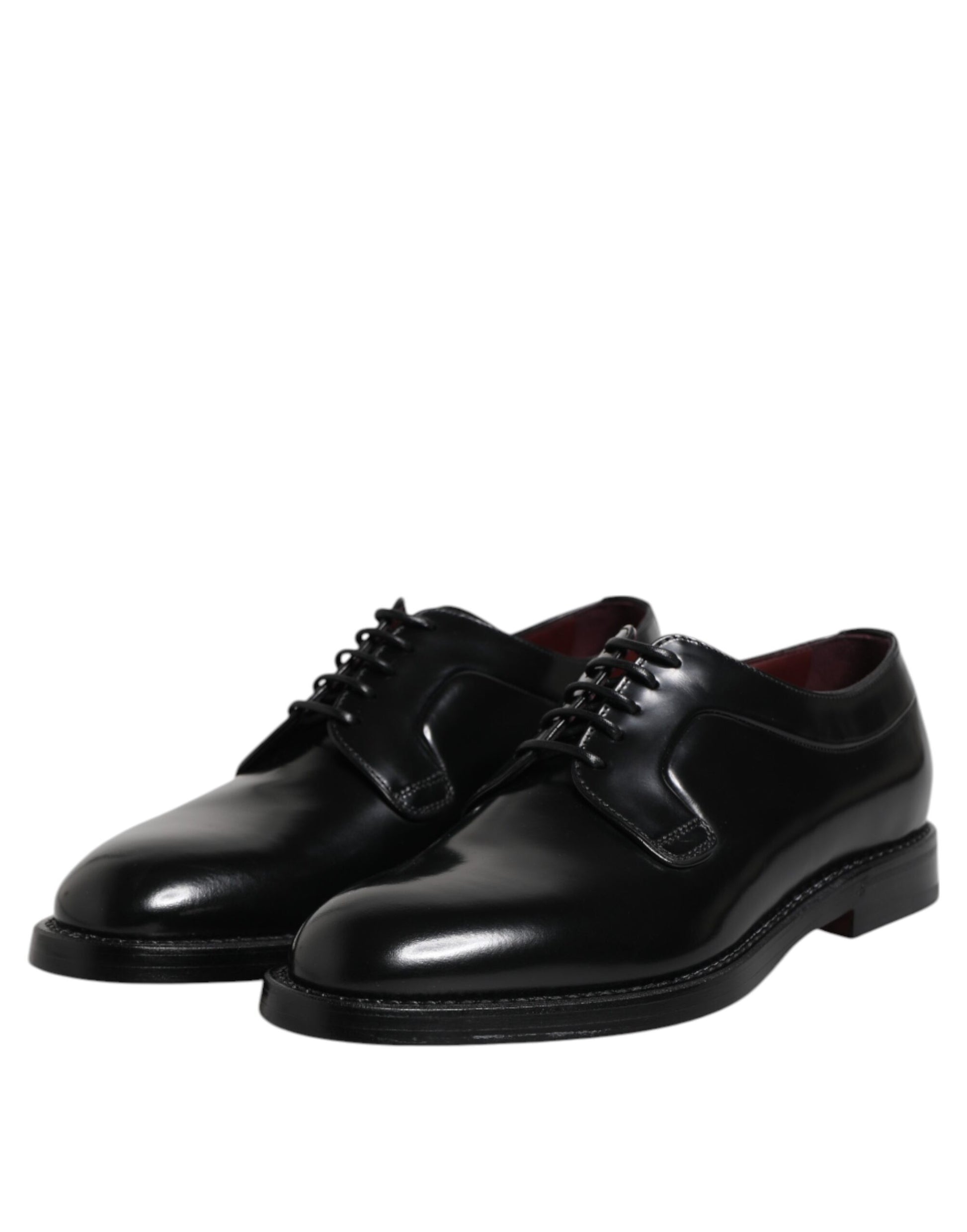 Pair of black leather lace-up dress shoes with a shiny finish