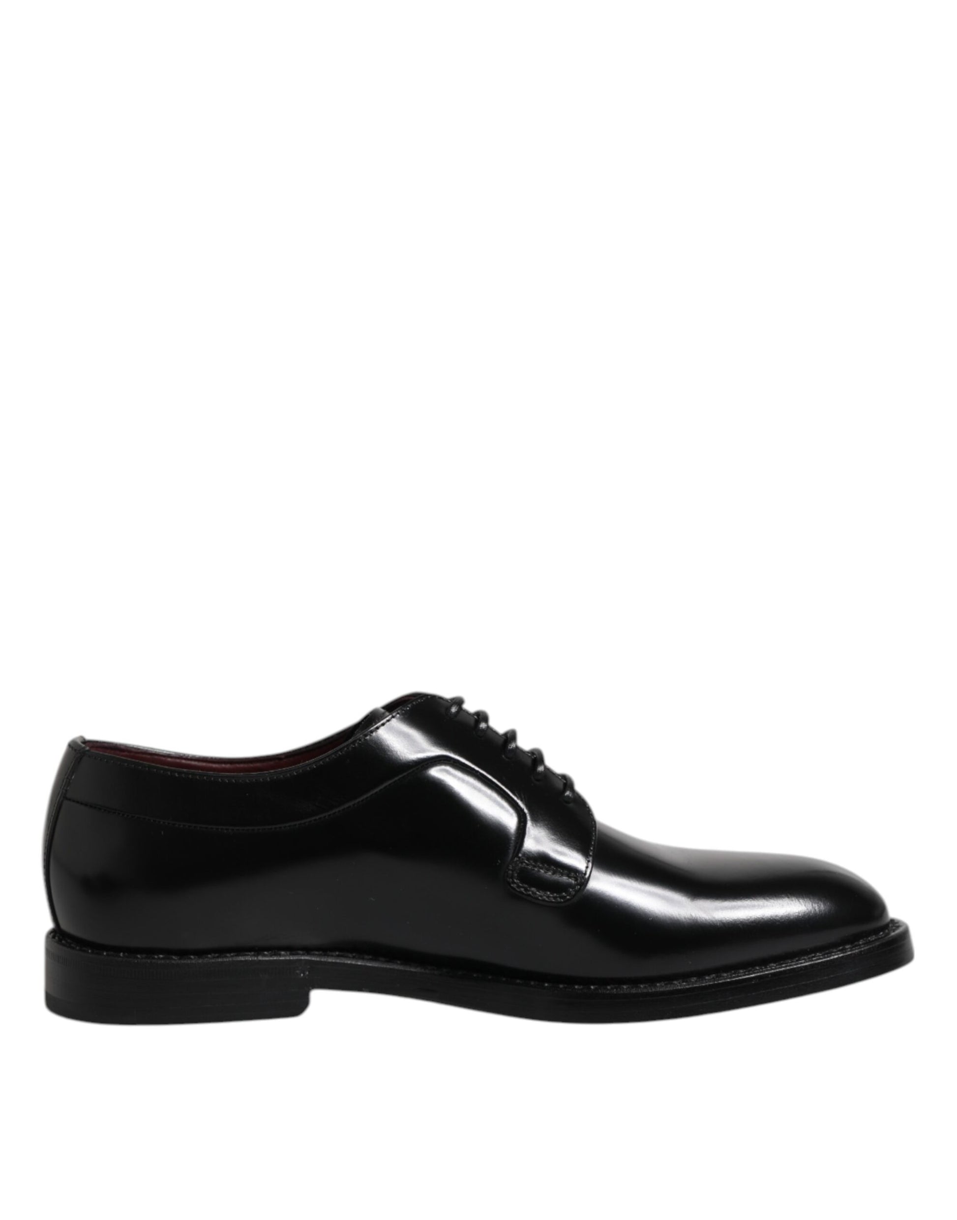 A pair of black dress shoes with laces, made from calf leather by Dolce & Gabbana