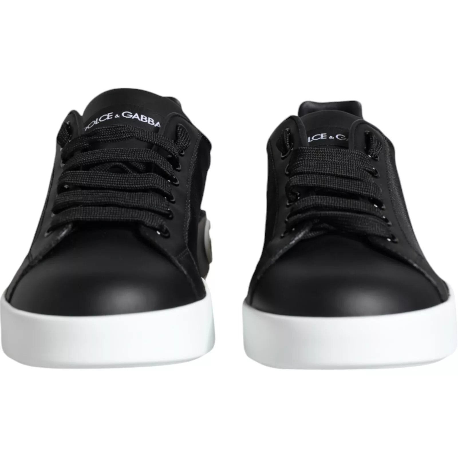 Pair of black leather sneakers with white soles and laces, featuring the Dolce & Gabbana logo