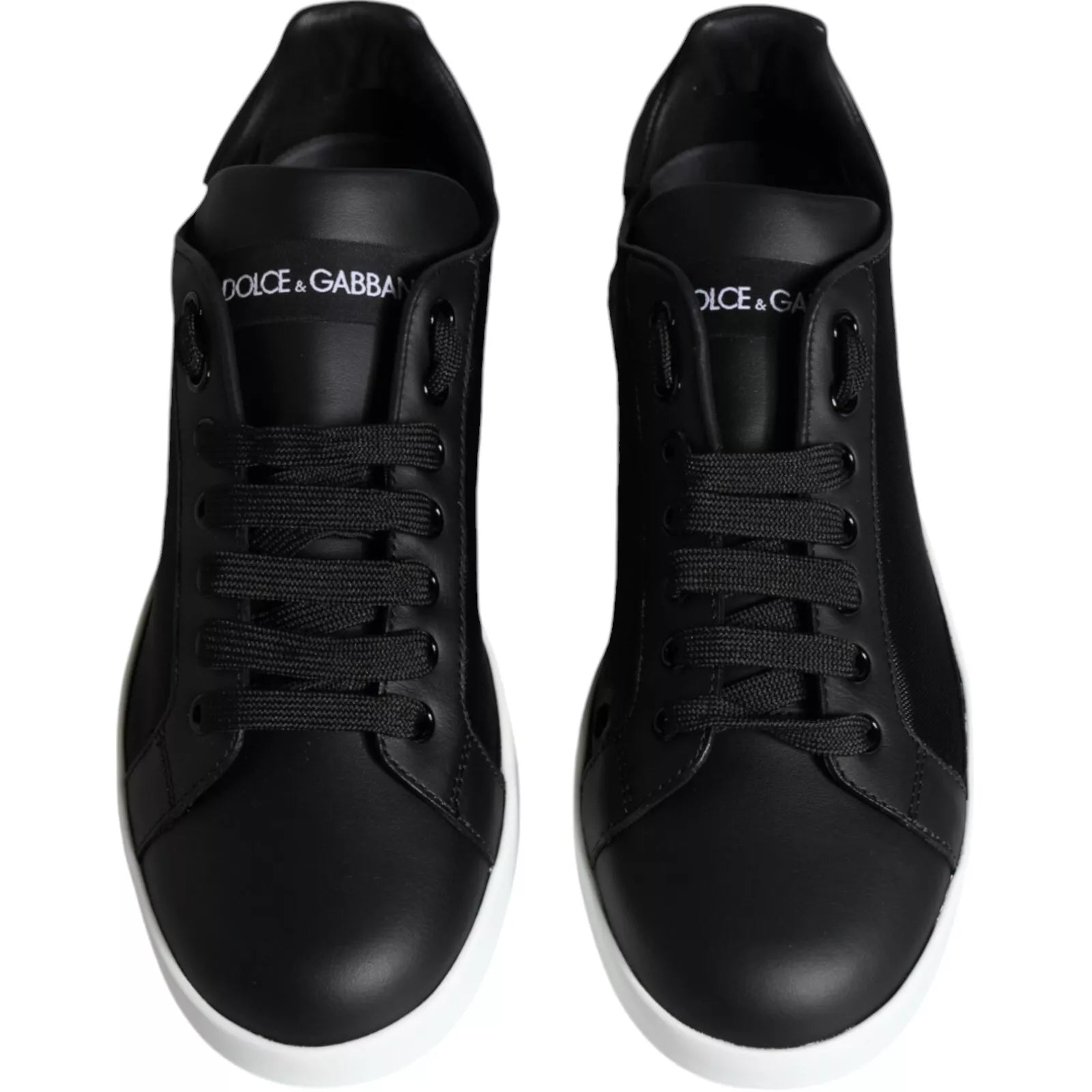 Pair of black leather sneakers with white soles, featuring the Dolce & Gabbana logo