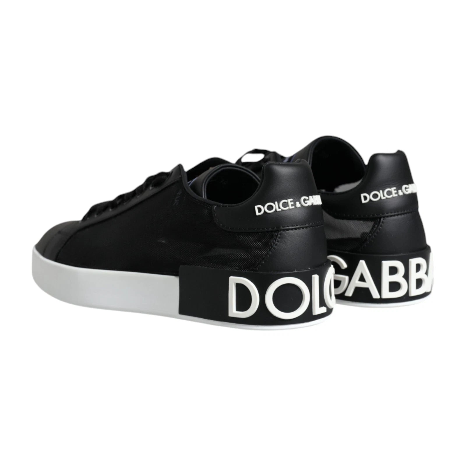 Pair of black calf leather sneakers with white soles, featuring the Dolce & Gabbana logo on side