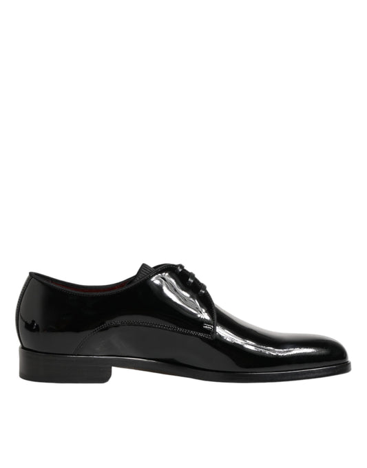 A pair of black leather dress shoes with a shiny finish, featuring a lace-up design and a small heel