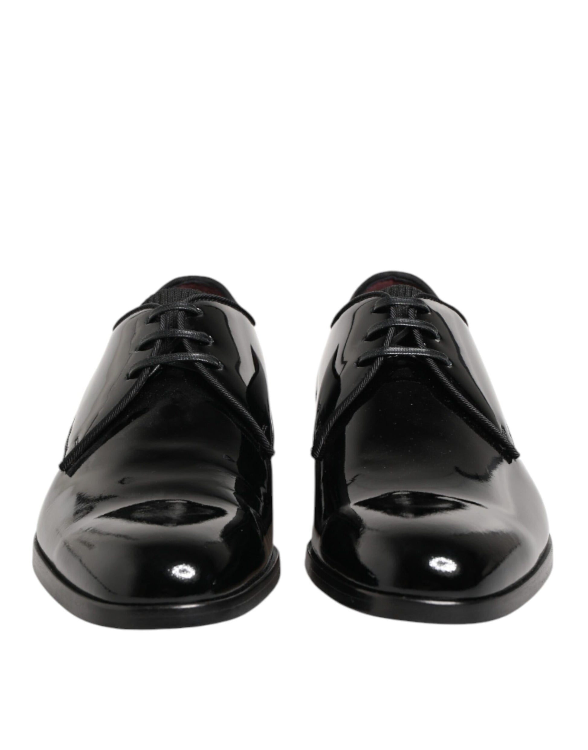 Pair of black leather dress shoes with laces and a shiny finish