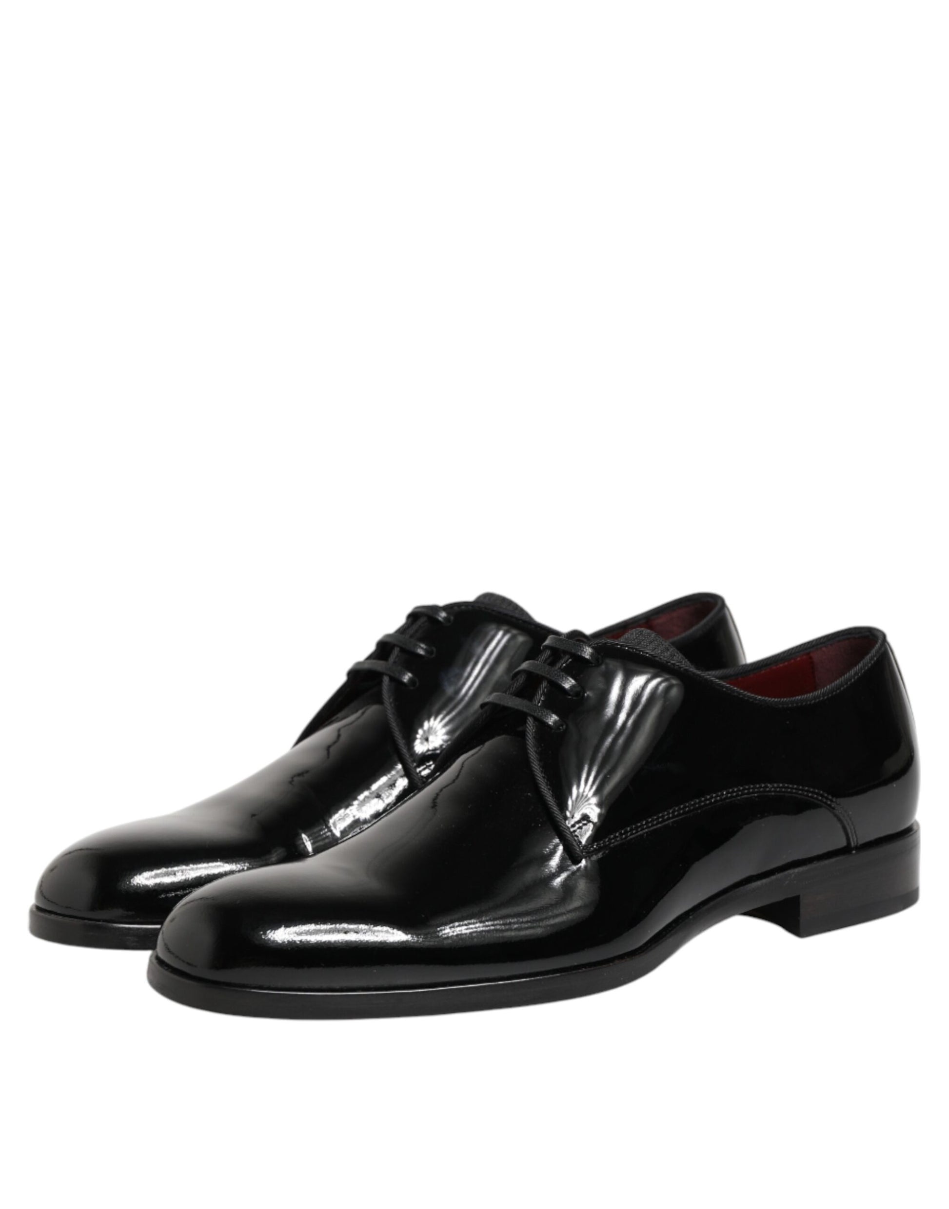 Pair of black leather dress shoes with laces and a shiny finish