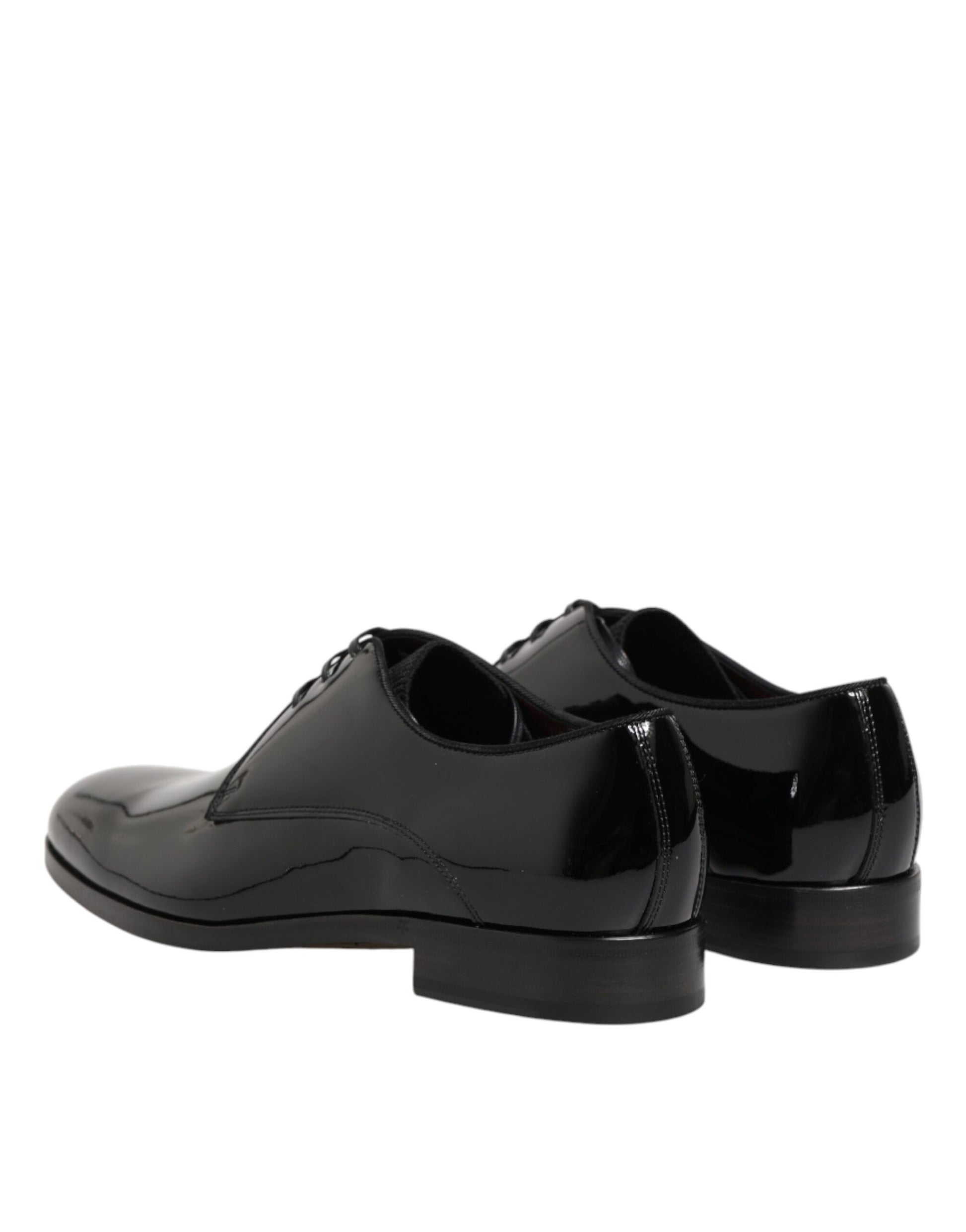 Pair of black leather dress shoes with laces and a shiny finish