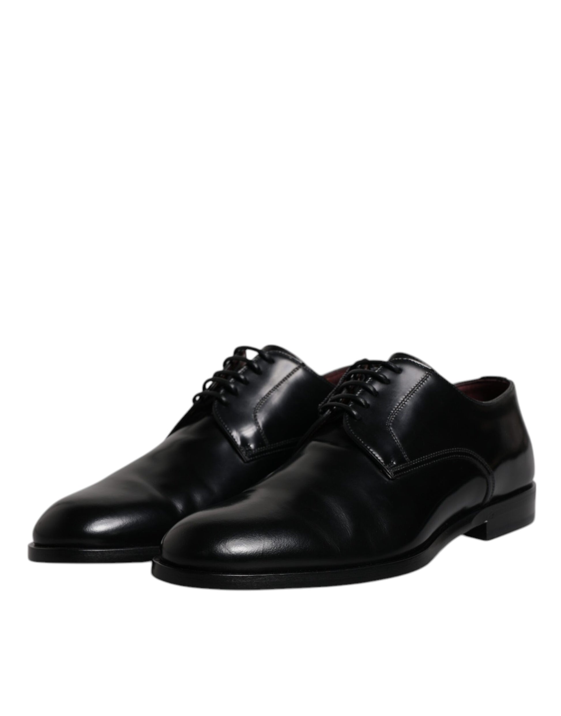 Pair of black leather lace-up dress shoes with a shiny finish