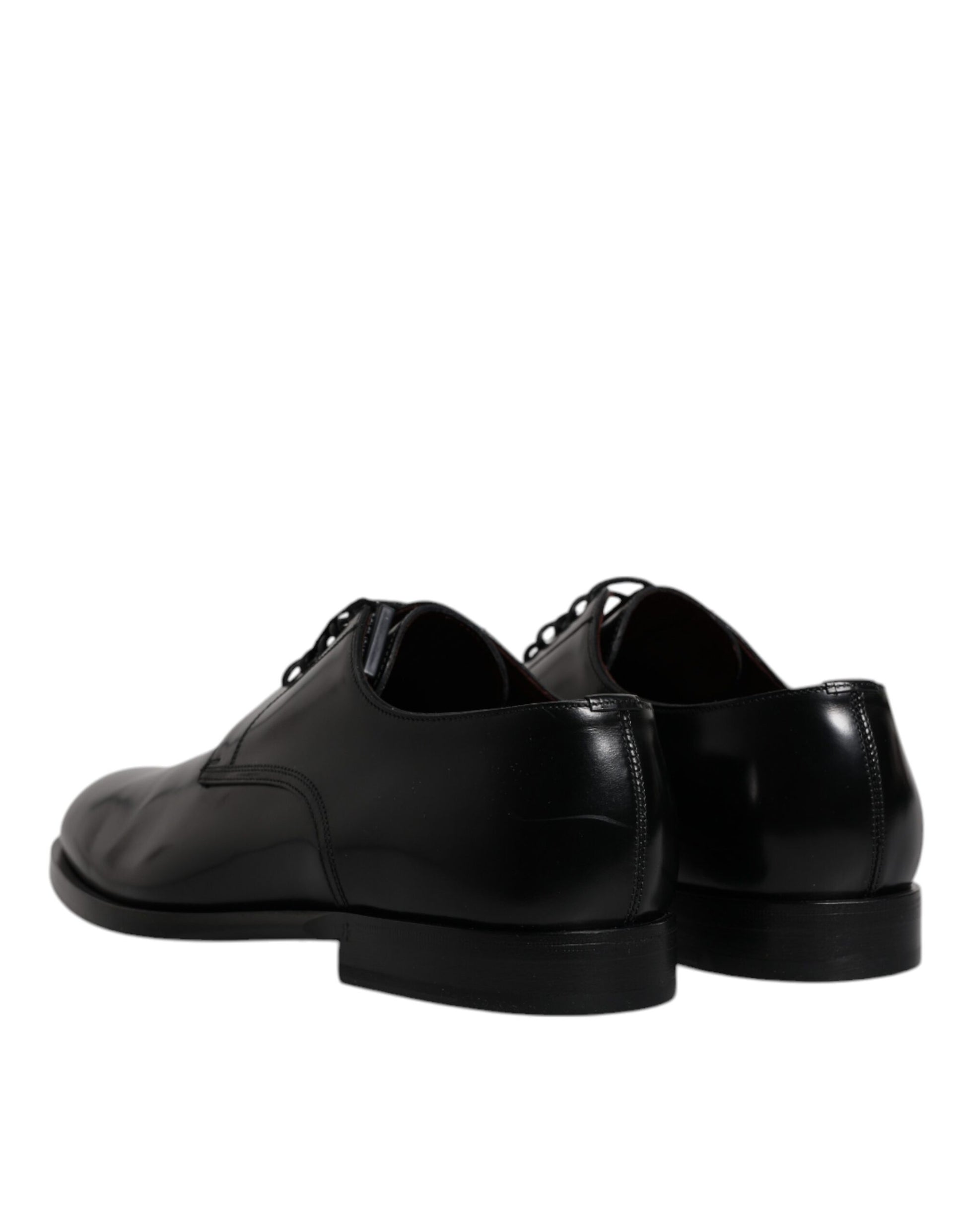 Pair of black leather lace-up dress shoes with rubber soles