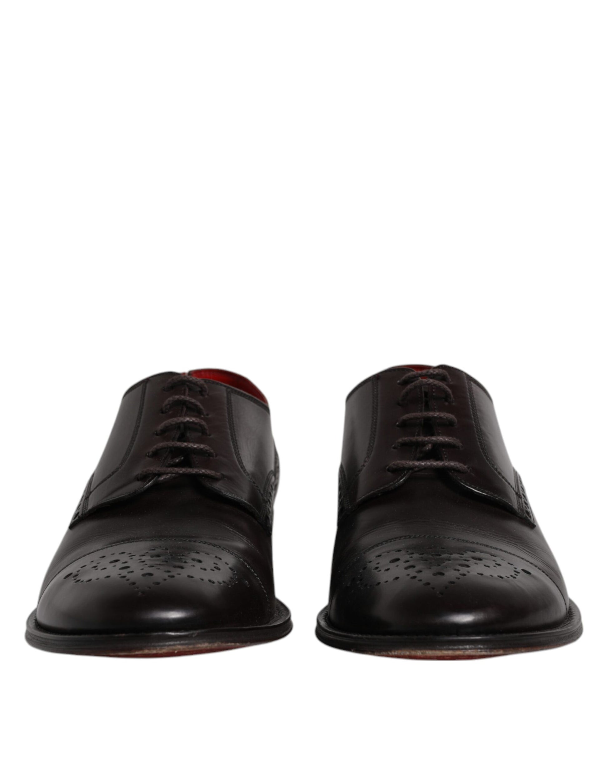 Pair of black leather dress shoes with laces and red soles, designed by Dolce & Gabbana