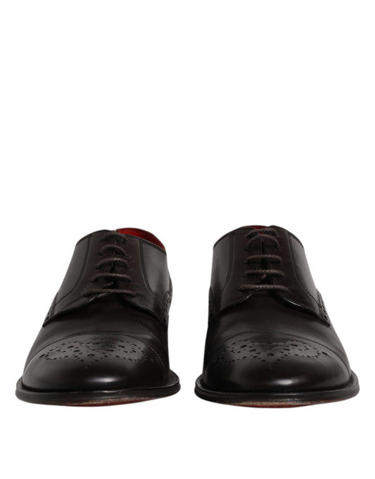 Pair of black leather dress shoes with laces and red soles, designed by Dolce & Gabbana