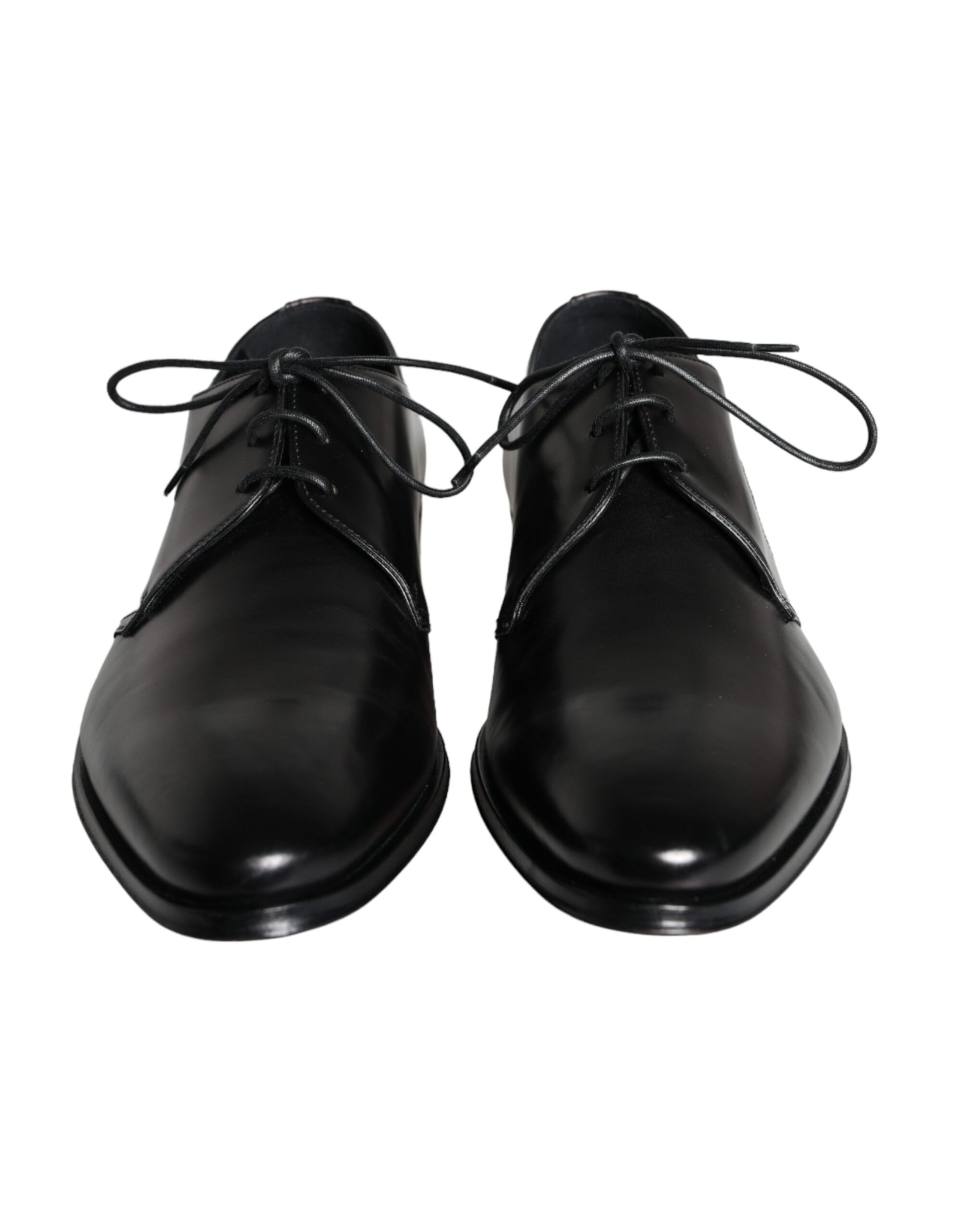 Pair of black leather dress shoes with laces and a shiny finish