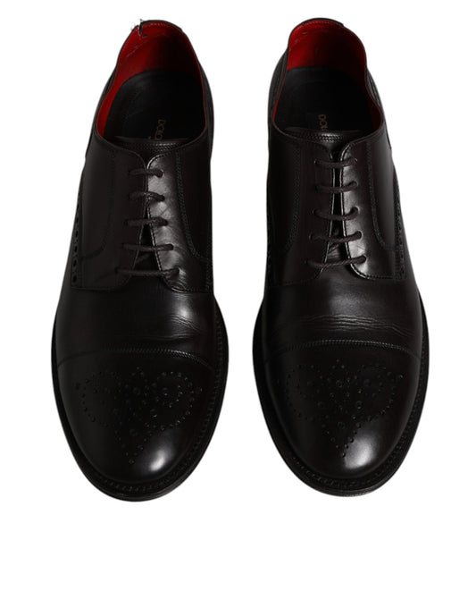 Pair of black leather dress shoes with laces and a small heel, featuring a textured pattern on the toe