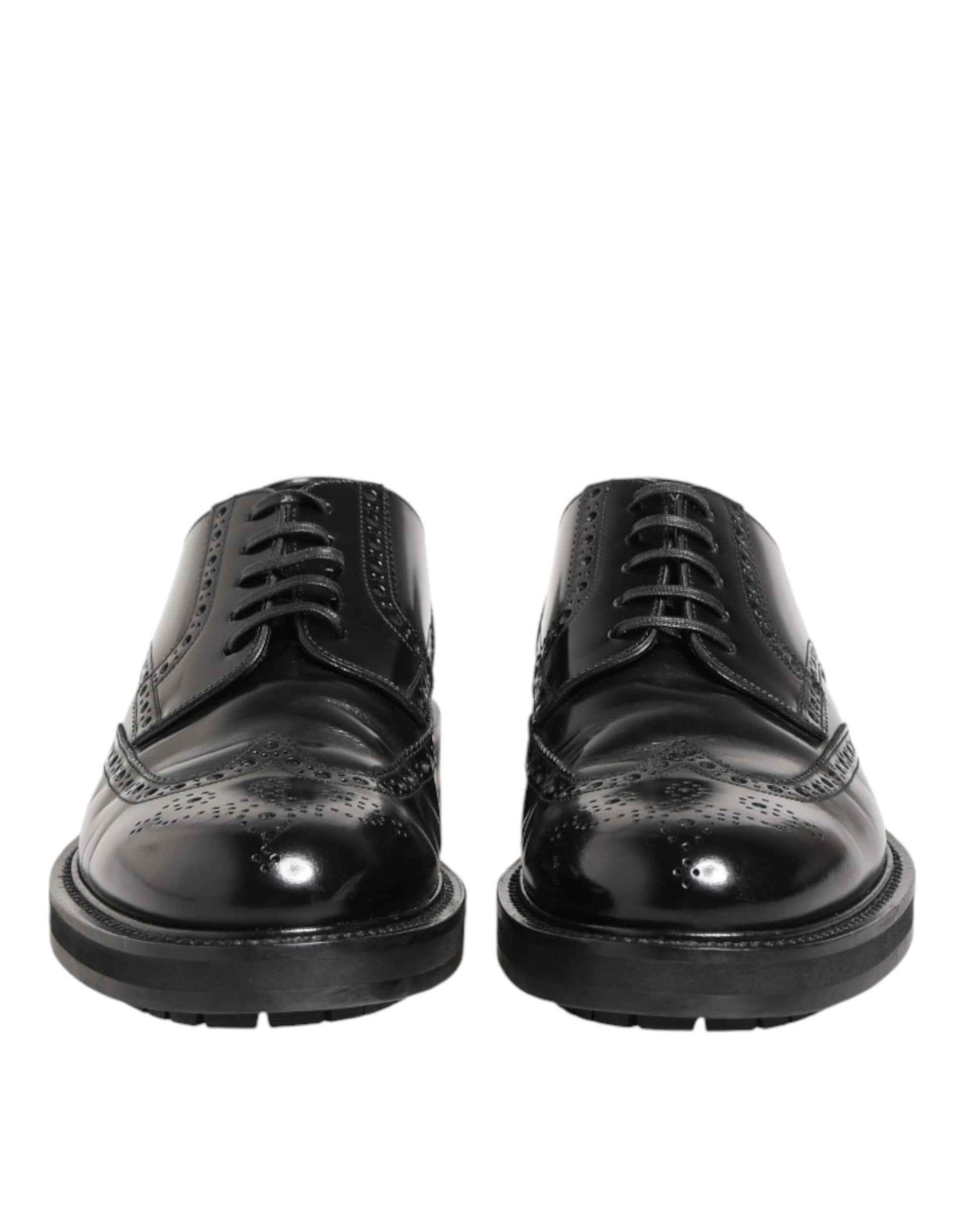 Pair of black leather dress shoes with laces and a shiny finish